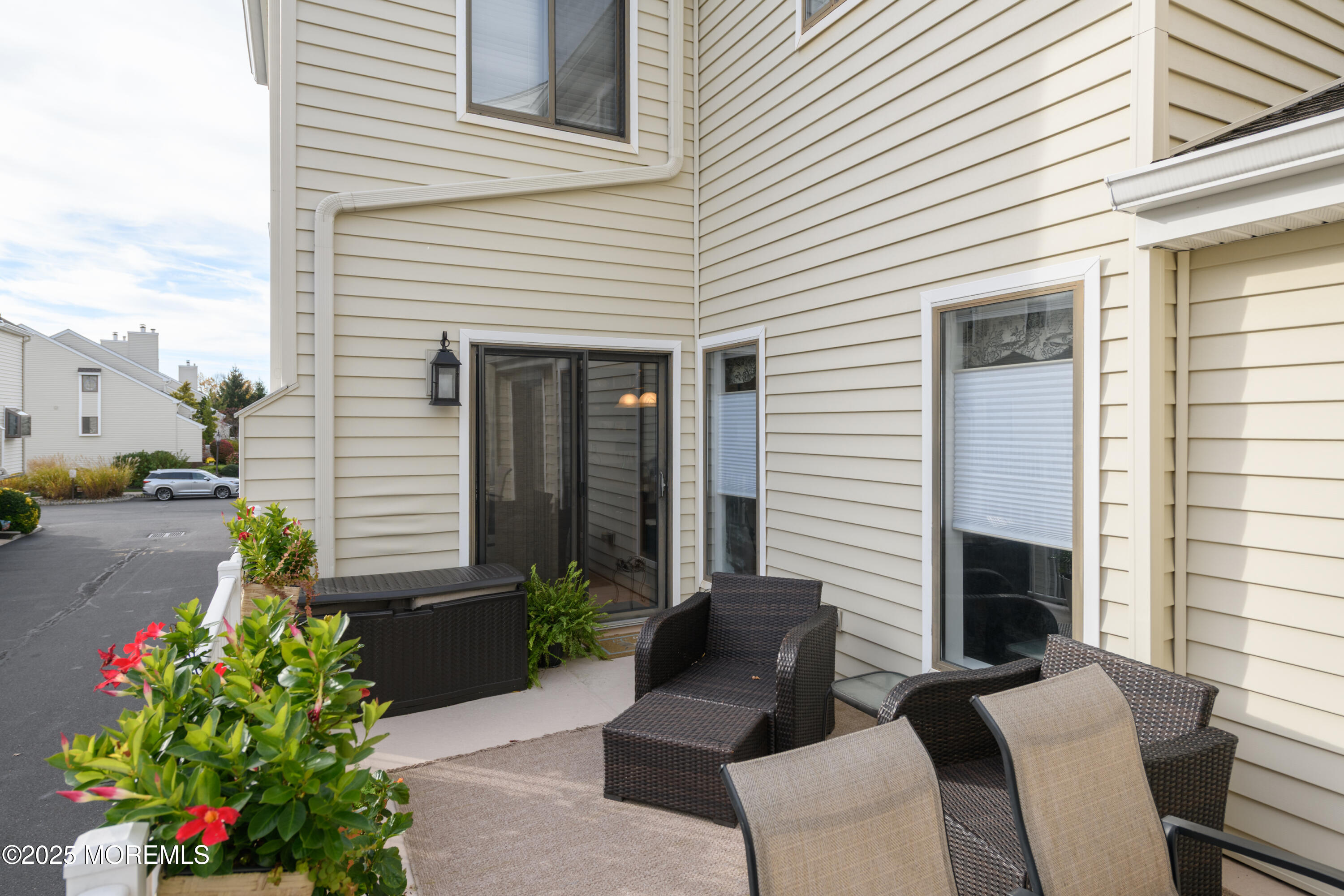 580 Patten Avenue, Unit 31 Long Branch, NJ 07740 - Photo 11 of 30 a view of a house with a chairs in patio