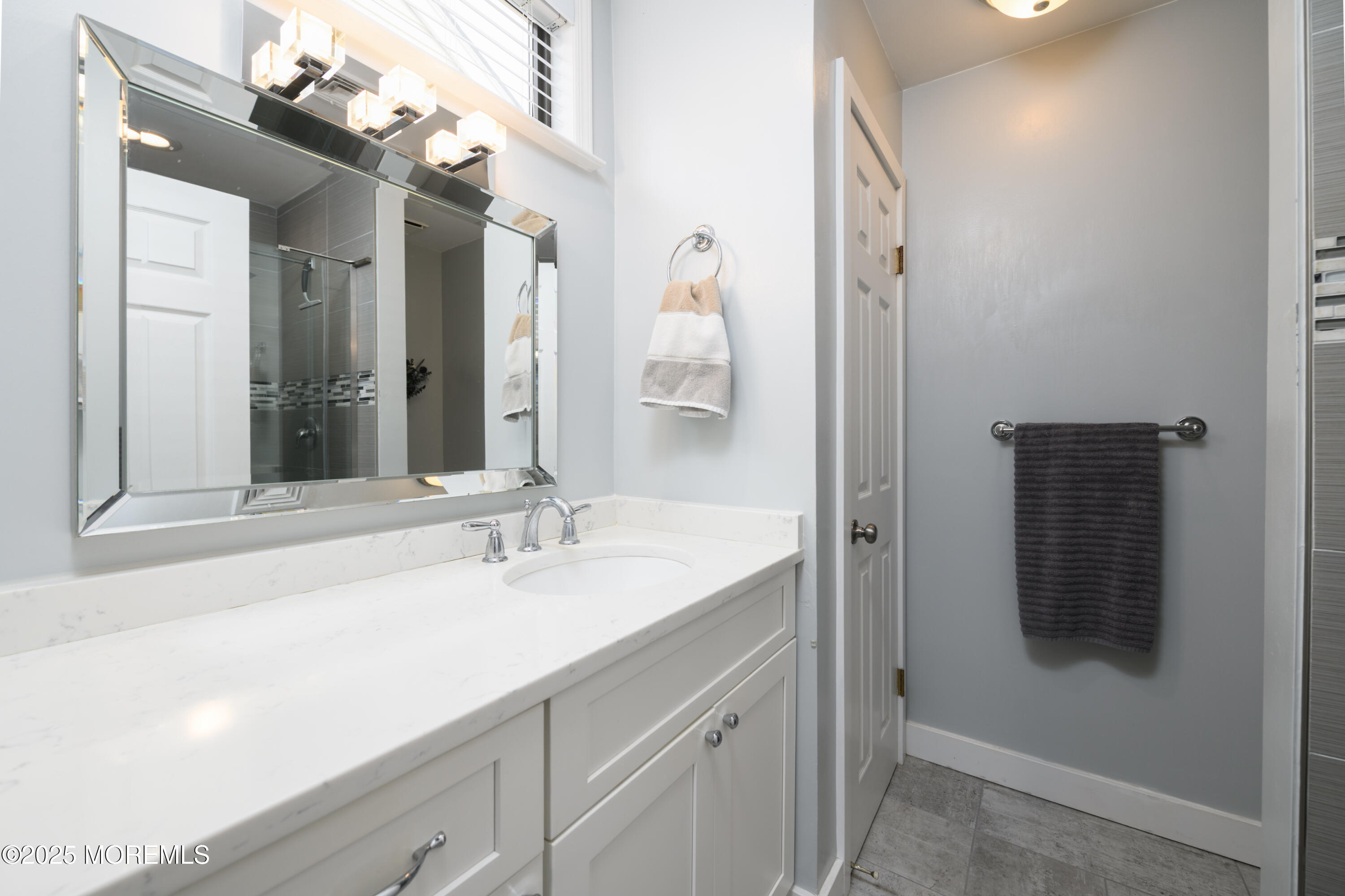 580 Patten Avenue, Unit 31 Long Branch, NJ 07740 - Photo 14 of 30 a bathroom with a sink and a mirror