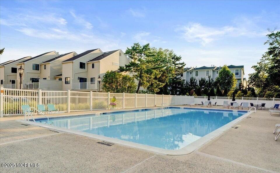 580 Patten Avenue, Unit 31 Long Branch, NJ 07740 - Photo 19 of 30 a view of swimming pool with outdoor seating and plants