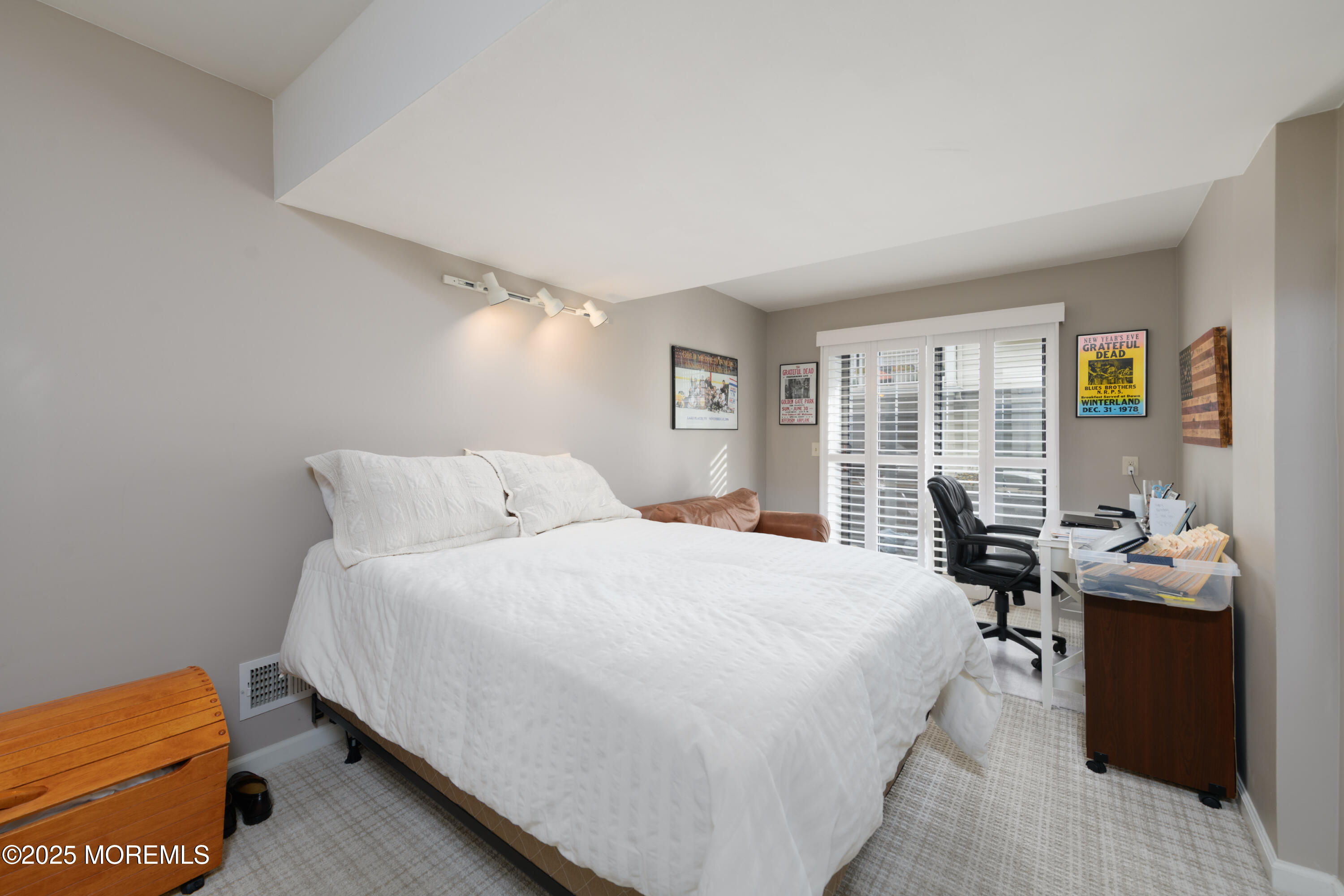 580 Patten Avenue, Unit 31 Long Branch, NJ 07740 - Photo 22 of 30 a bedroom with a bed and a window