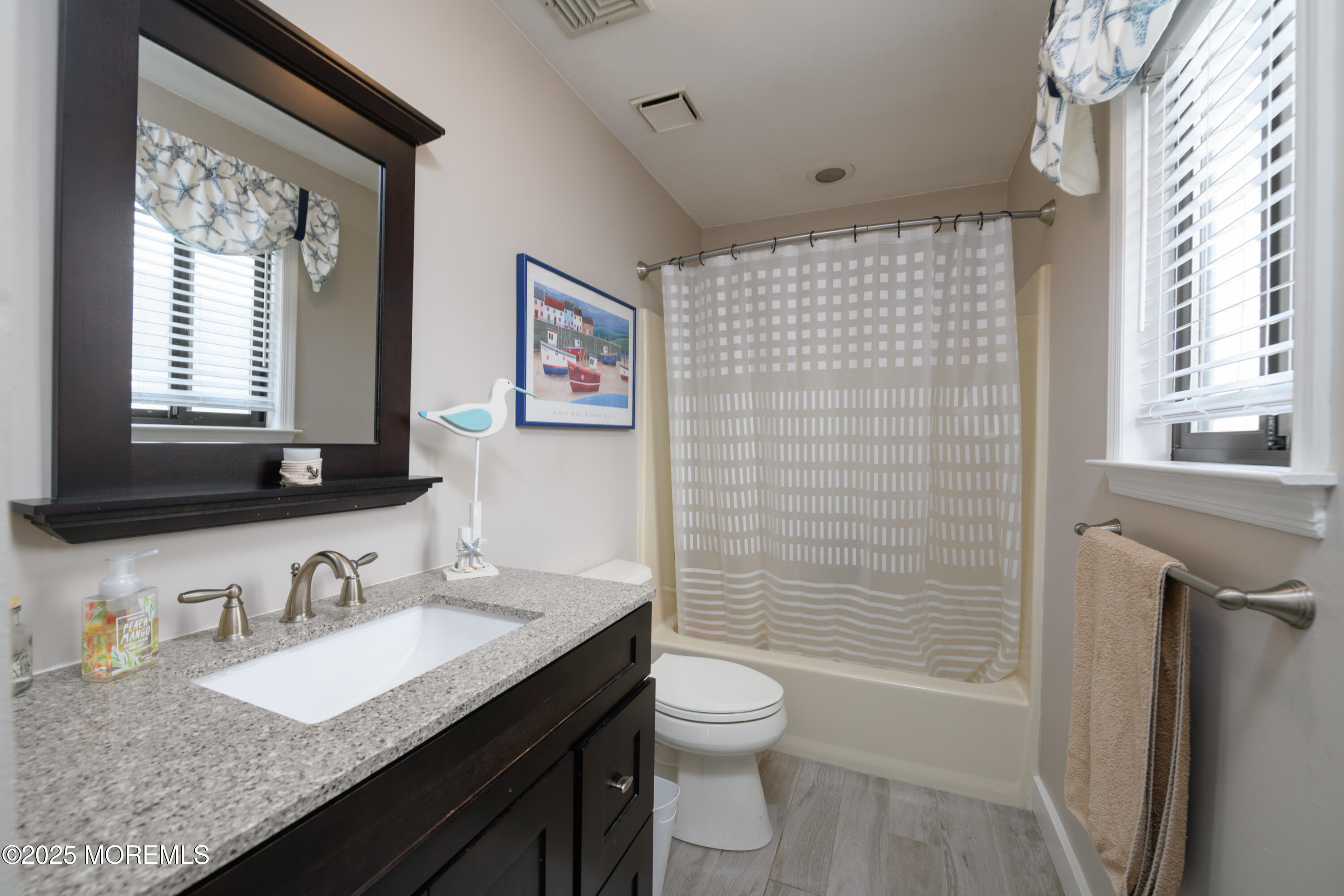 580 Patten Avenue, Unit 31 Long Branch, NJ 07740 - Photo 28 of 30 a bathroom with a granite countertop sink toilet and shower