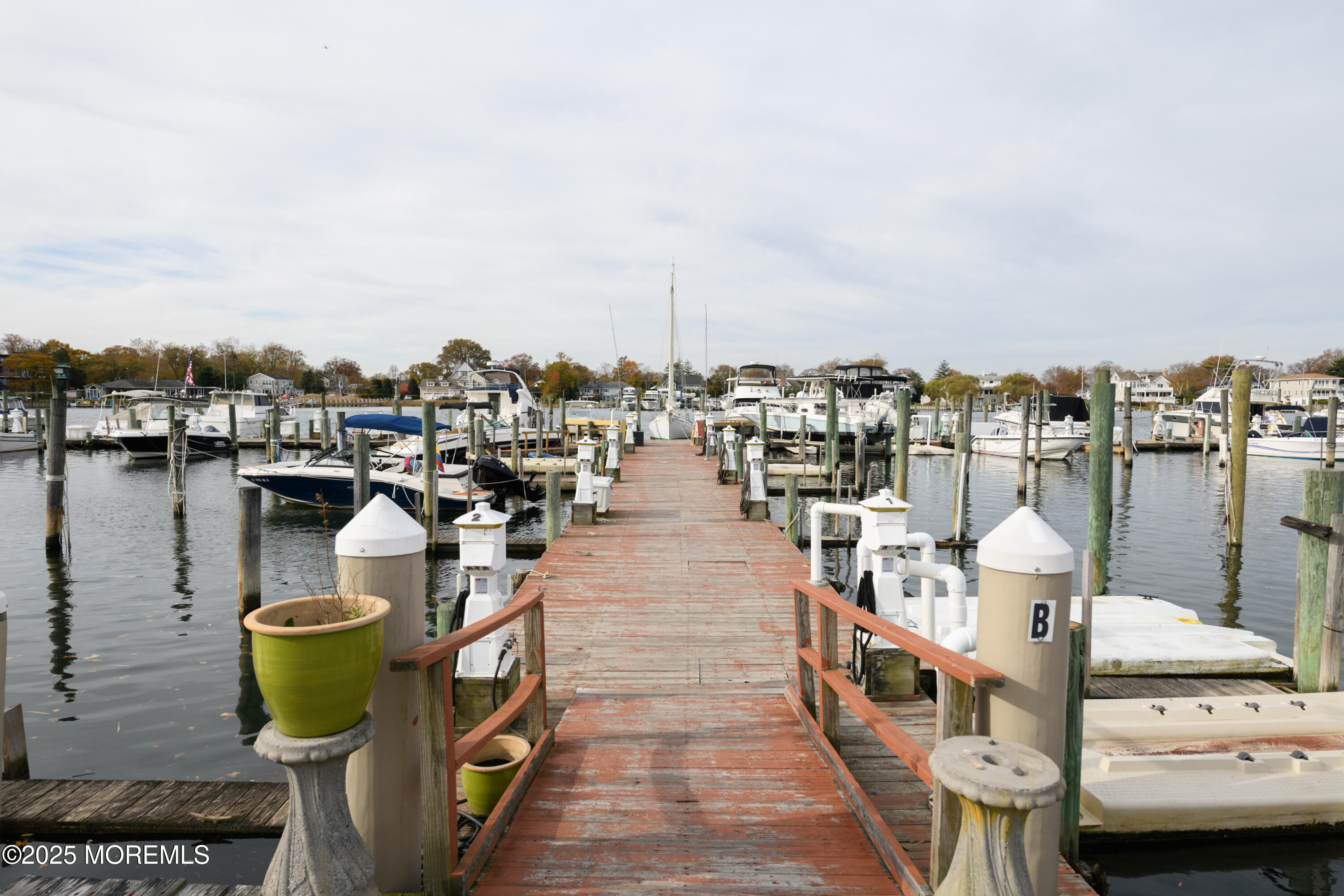 580 Patten Avenue, Unit 31 Long Branch, NJ 07740 - Photo 30 of 30 a lake view with boat and palm trees
