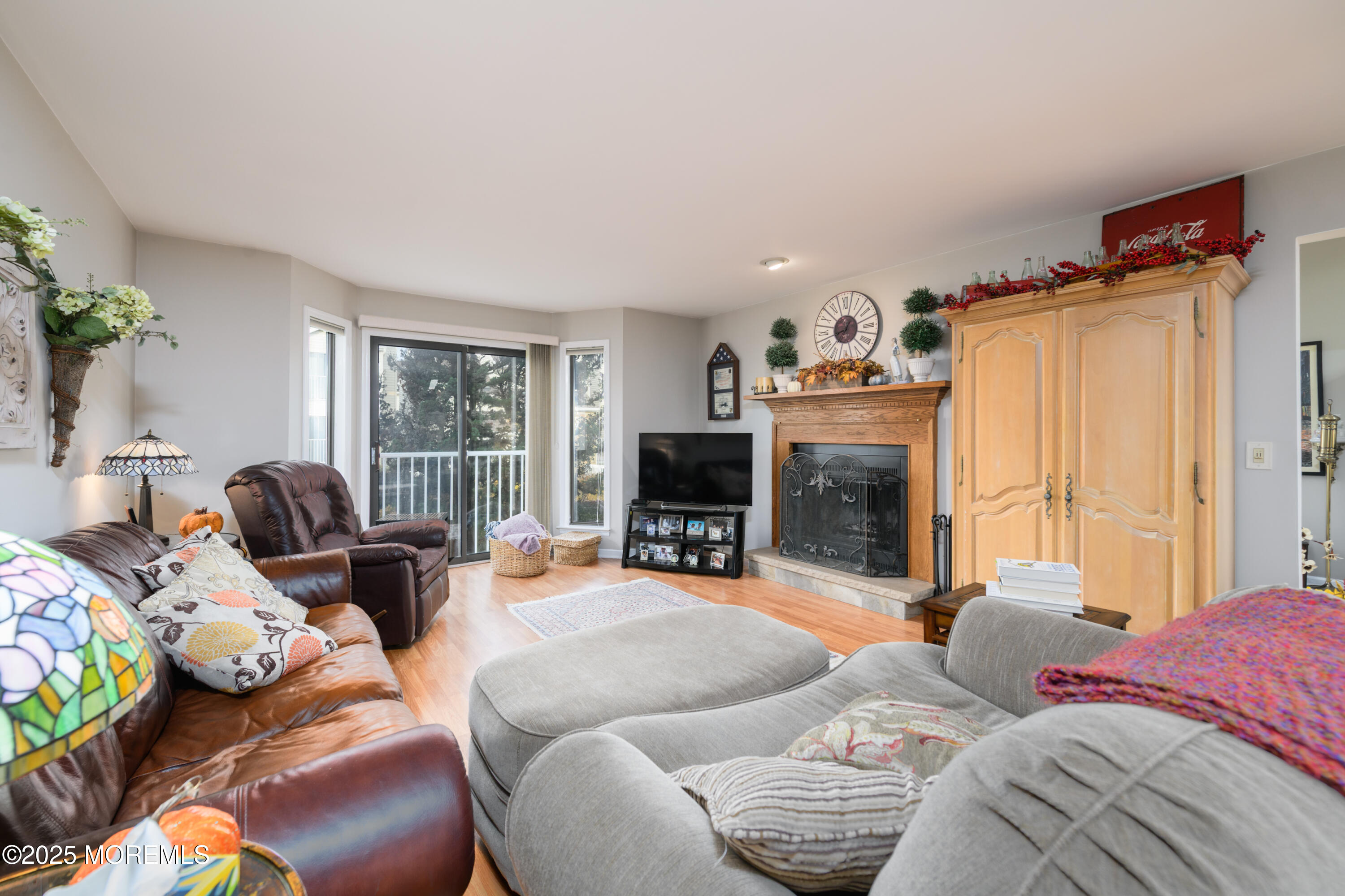 580 Patten Avenue, Unit 31 Long Branch, NJ 07740 - Photo 4 of 30 a living room with furniture and a fireplace