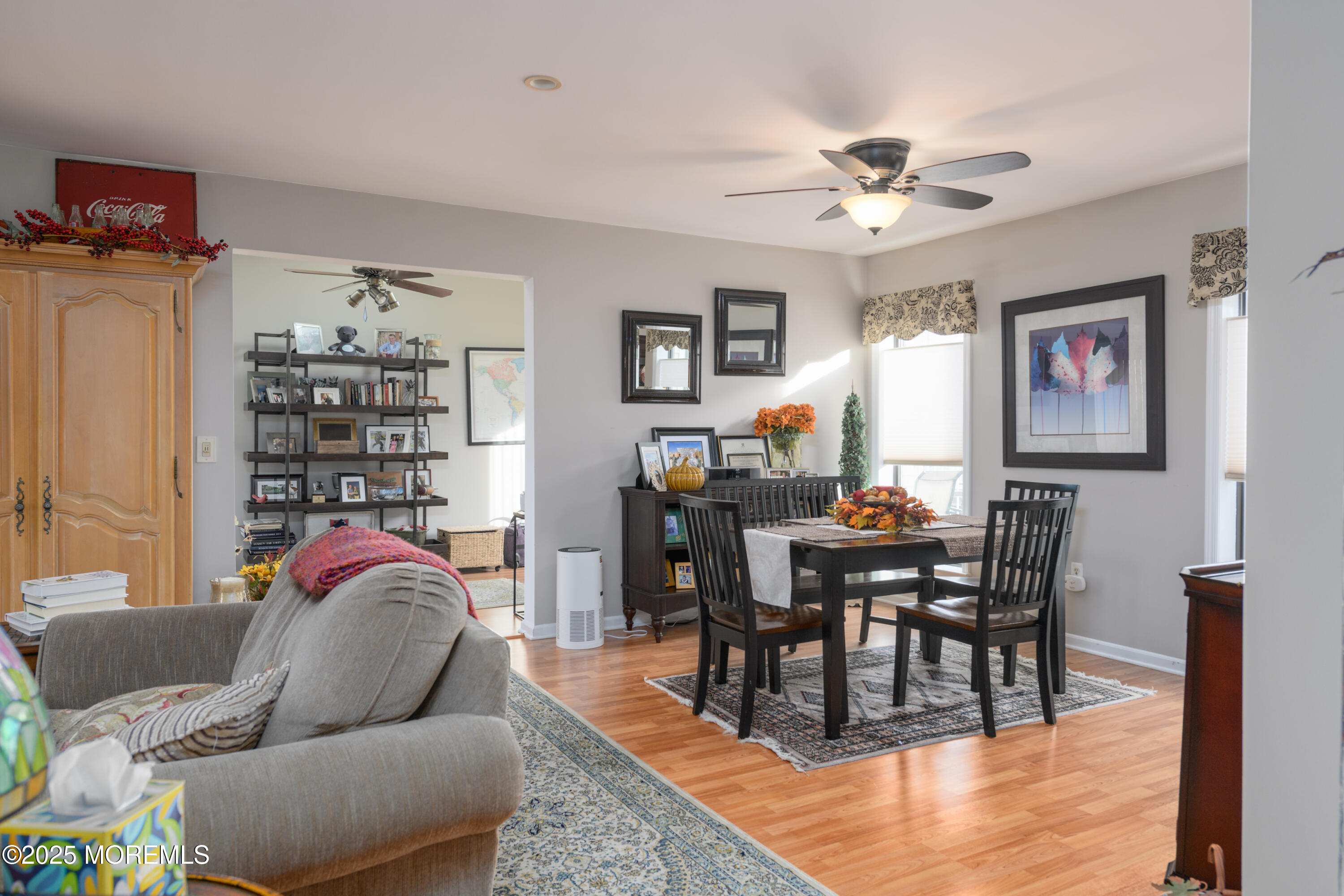 580 Patten Avenue, Unit 31 Long Branch, NJ 07740 - Photo 6 of 30 a living room with furniture a rug and a bookshelf