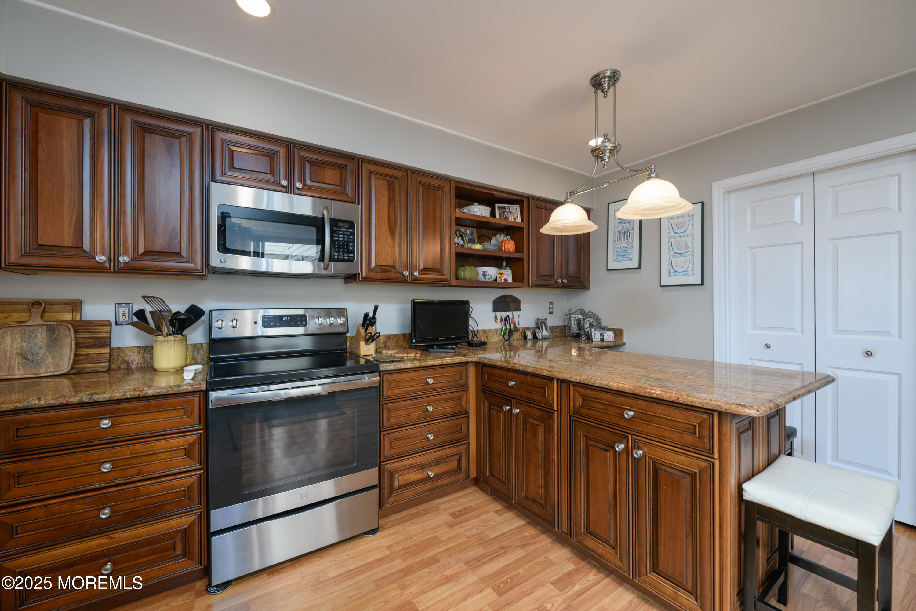 580 Patten Avenue, Unit 31 Long Branch, NJ 07740 - Photo 9 of 30 a kitchen with a sink stove and microwave