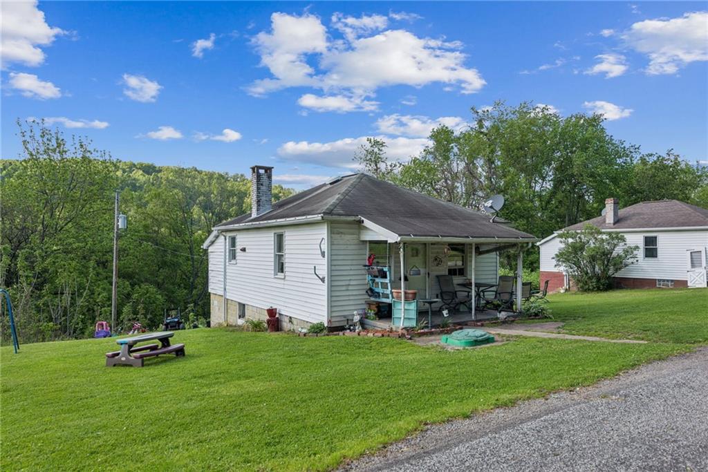 375 Reduction Road Smithton, PA 15479 - Photo 27 of 30 a view of a house with backyard and porch