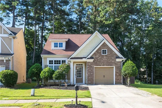 a front view of a house with yard