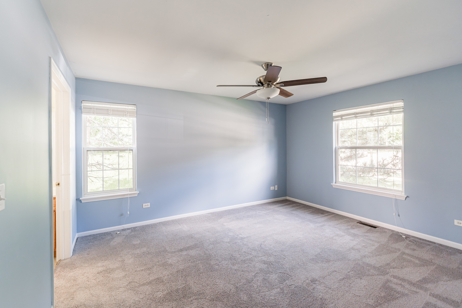 1202 North Red Oak Circle, Unit 2 Round Lake Beach, IL 60073 - Photo 11 of 19 a view of an empty room with a window