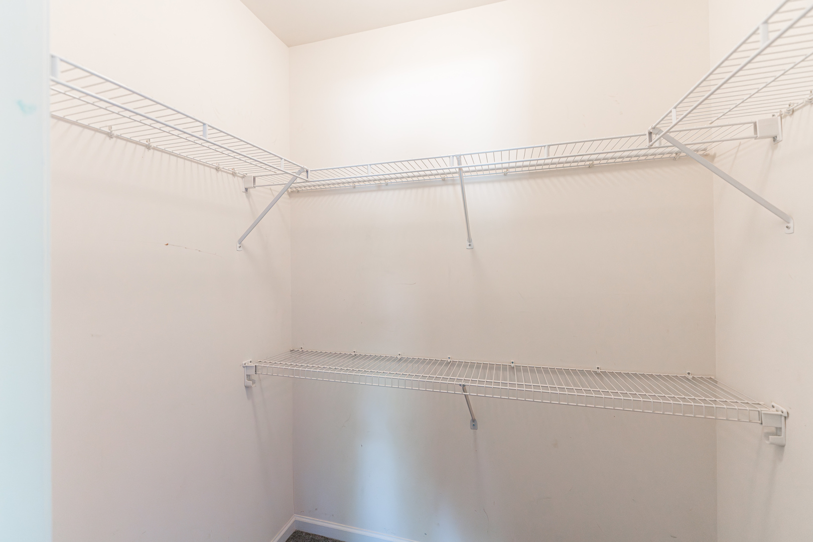 1202 North Red Oak Circle, Unit 2 Round Lake Beach, IL 60073 - Photo 13 of 19 a view of a room with racks on the wall