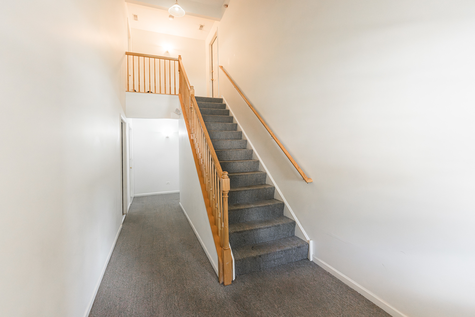 1202 North Red Oak Circle, Unit 2 Round Lake Beach, IL 60073 - Photo 16 of 19 a view of entryway and hall with wooden floor