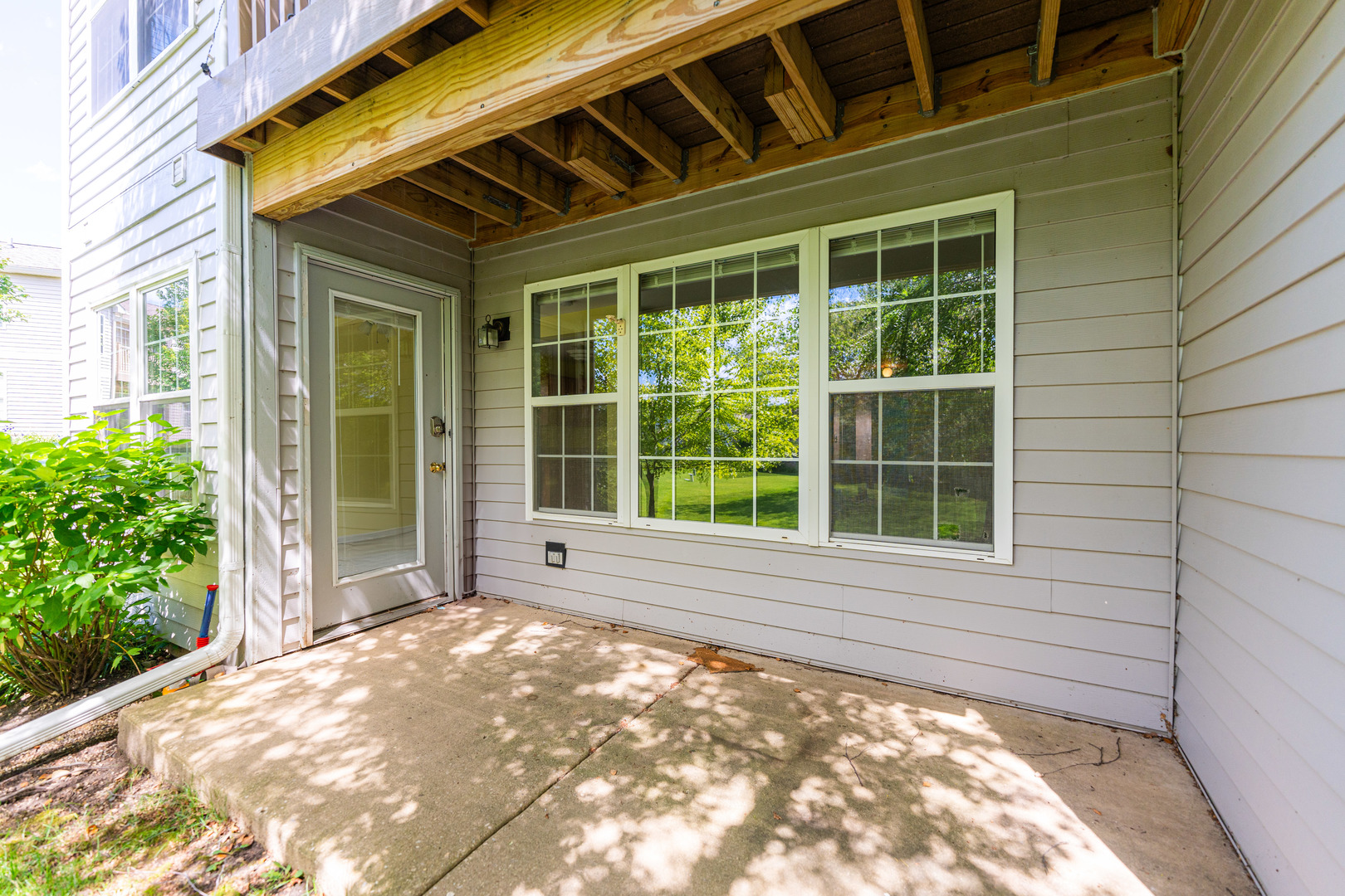 1202 North Red Oak Circle, Unit 2 Round Lake Beach, IL 60073 - Photo 18 of 19 a view of a backyard of a house