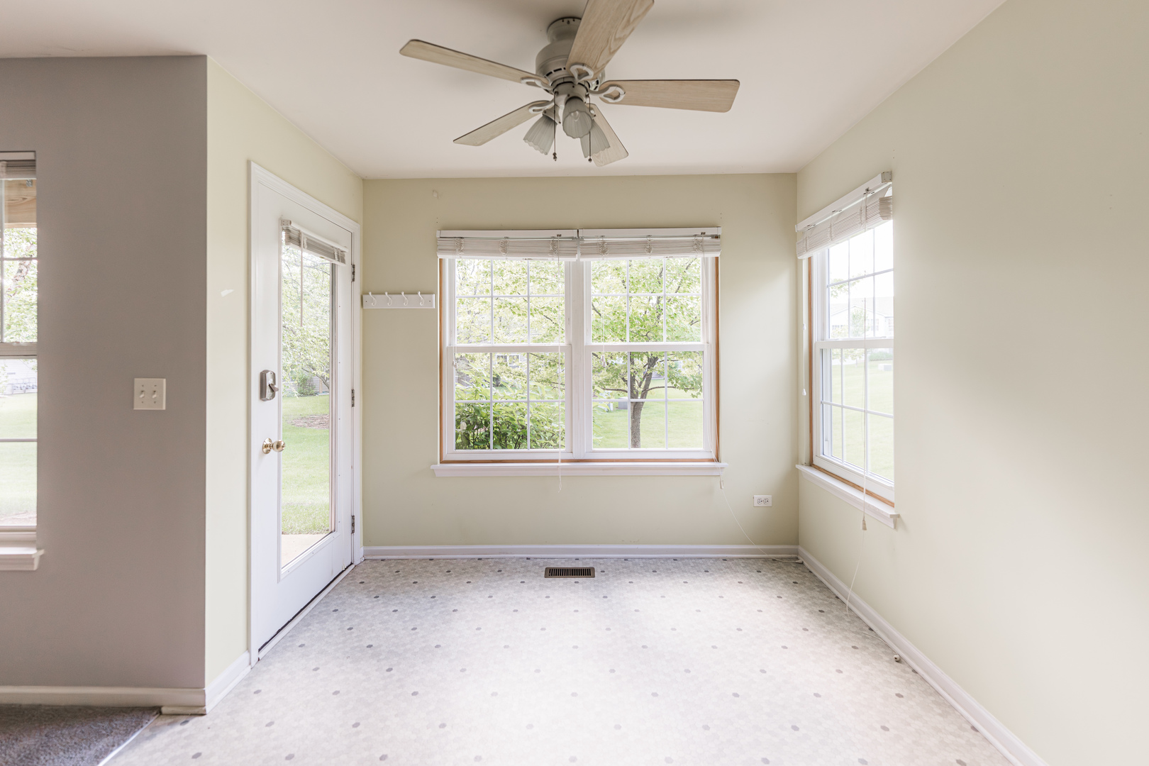 1202 North Red Oak Circle, Unit 2 Round Lake Beach, IL 60073 - Photo 2 of 19 a view of an empty room with a window