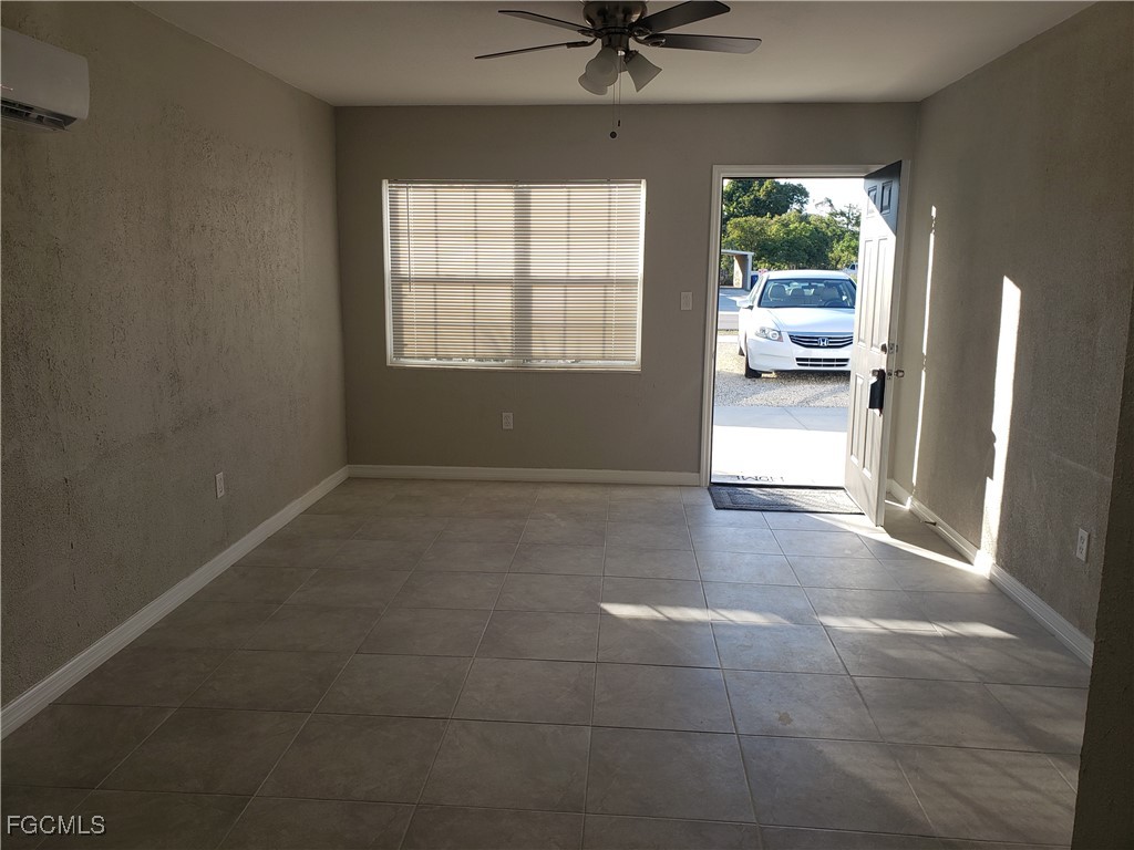 204 1st Street Fort Myers, FL 33907 - Photo 4 of 11 a view of a livingroom with a ceiling fan and window