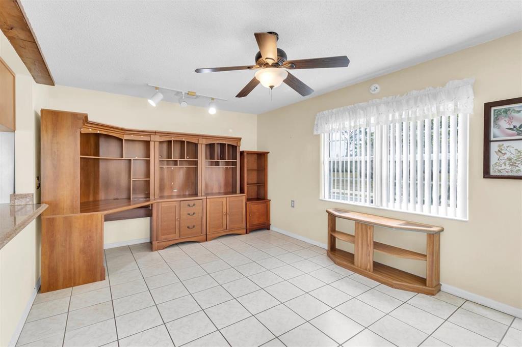 9058 Arundle Place New Port Richey, FL 34655 - Photo 14 of 59 a view of empty room with wooden floor and window