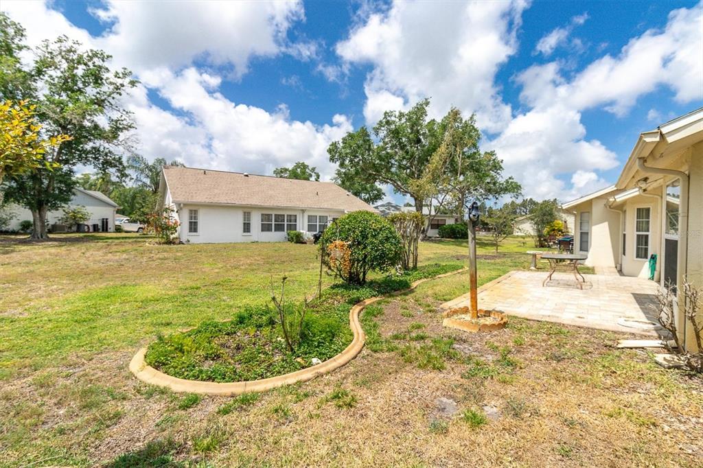 9058 Arundle Place New Port Richey, FL 34655 - Photo 25 of 59 a view of a house with swimming pool and sitting area