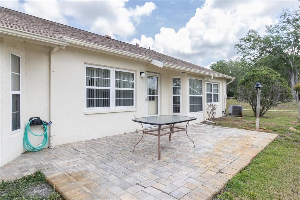 9058 Arundle Place New Port Richey, FL 34655 - Photo 29 of 59 a house view with a backyard space
