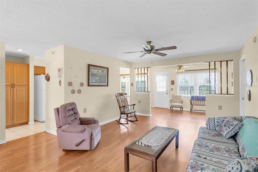 9058 Arundle Place New Port Richey, FL 34655 - Photo 5 of 59 a living room with furniture and a large window
