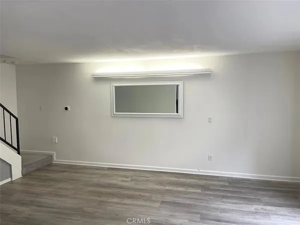 a view of a livingroom with wooden floor