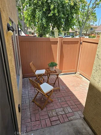 an outdoor sitting area with furniture