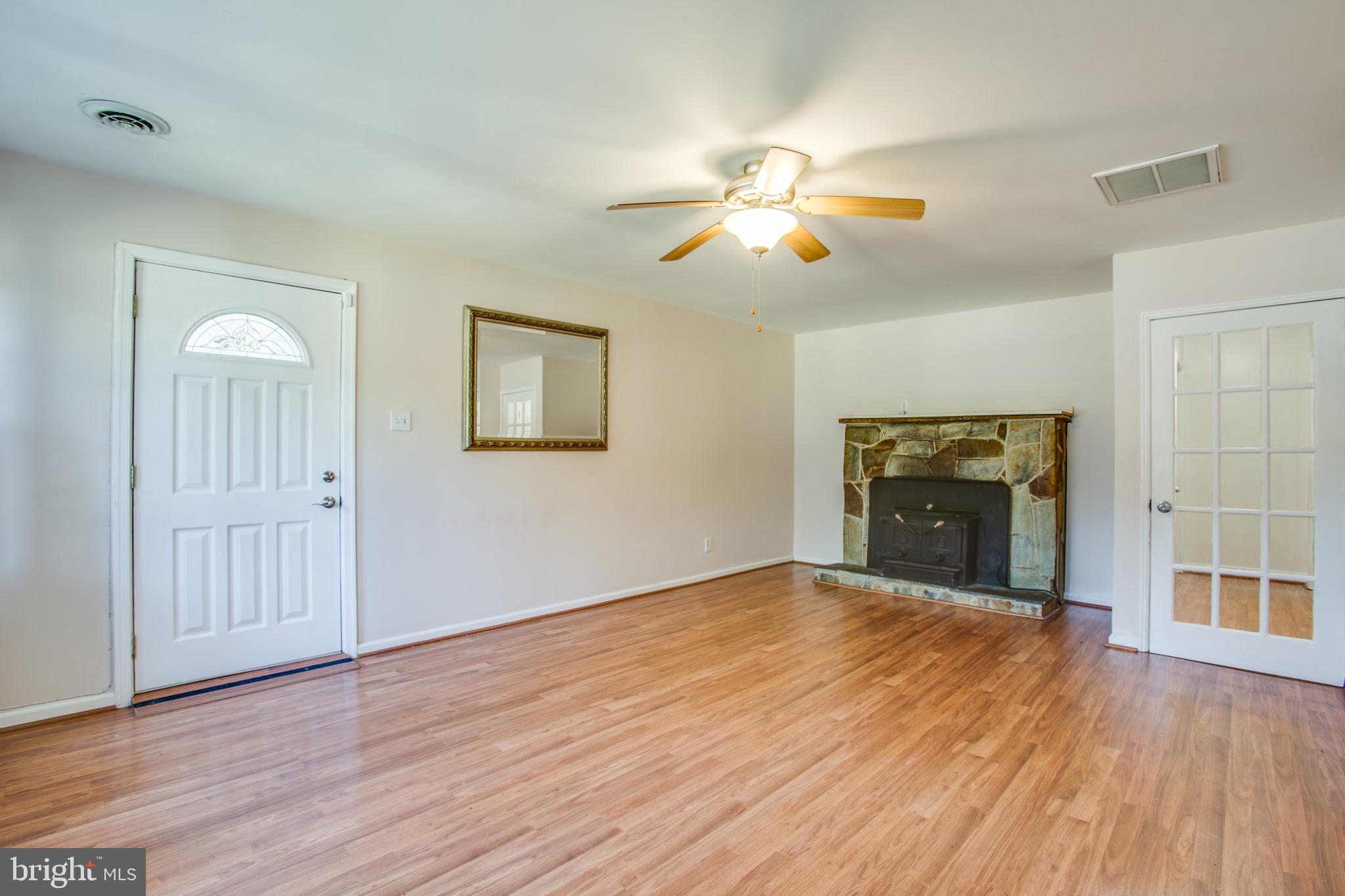 655 Courthouse Road Stafford, VA 22554 - Photo 24 of 47 Stone clad fireplace with wood stove insert