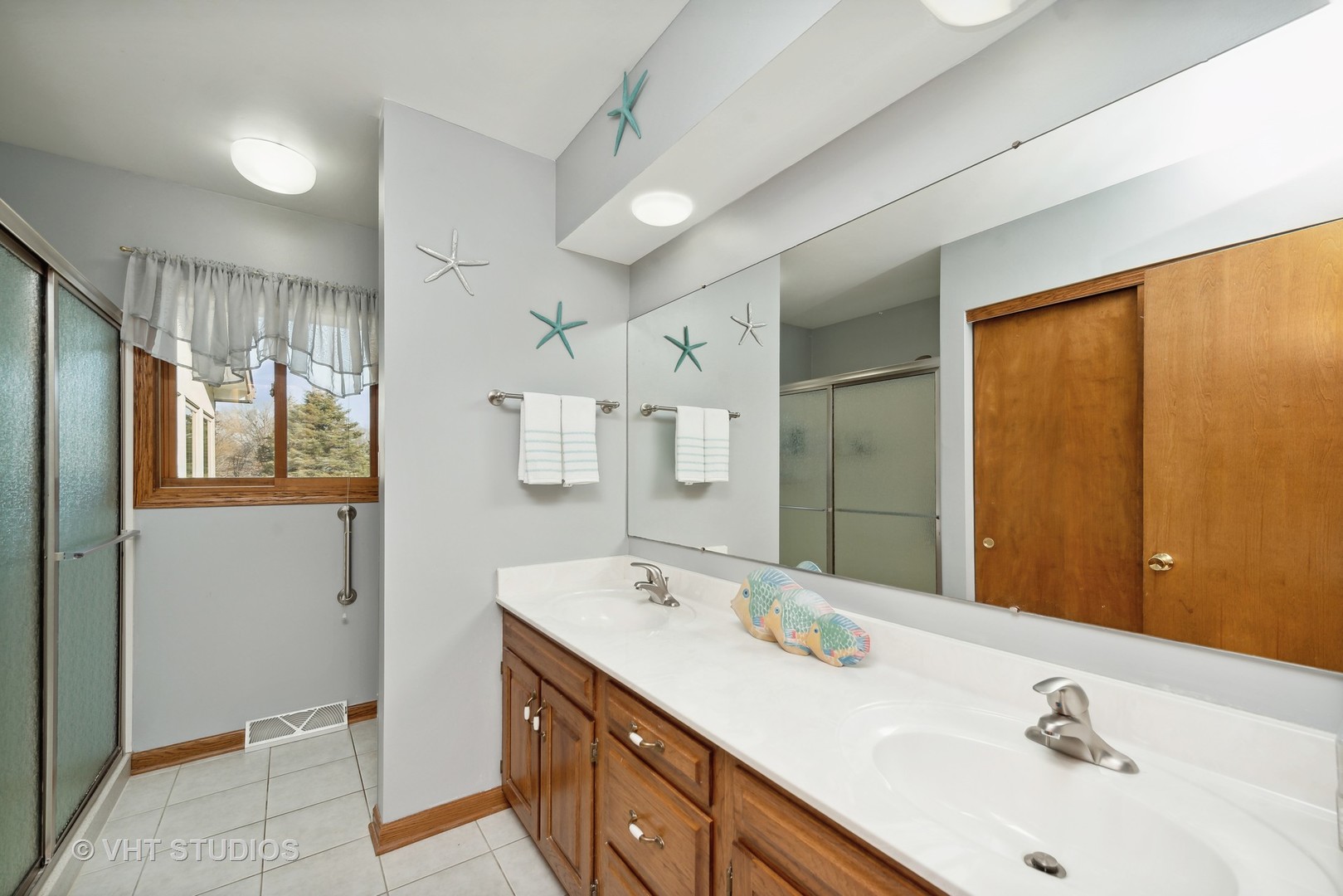 28046 Brandenburg Road Ingleside, IL 60041 - Photo 11 of 17 a spacious bathroom with a double vanity sink and a mirror