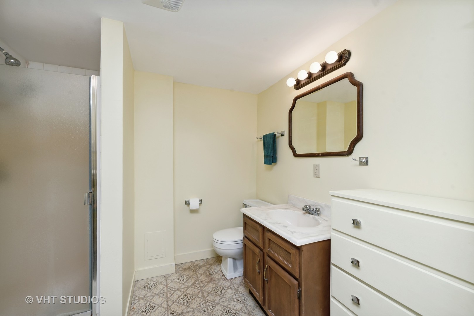 28046 Brandenburg Road Ingleside, IL 60041 - Photo 15 of 17 a bathroom with a toilet sink vanity and mirror