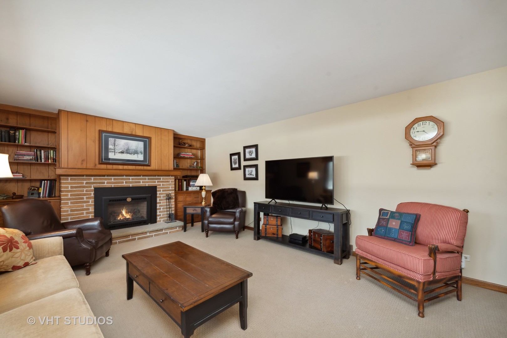 28046 Brandenburg Road Ingleside, IL 60041 - Photo 3 of 17 a living room with furniture a flat screen tv and a fireplace