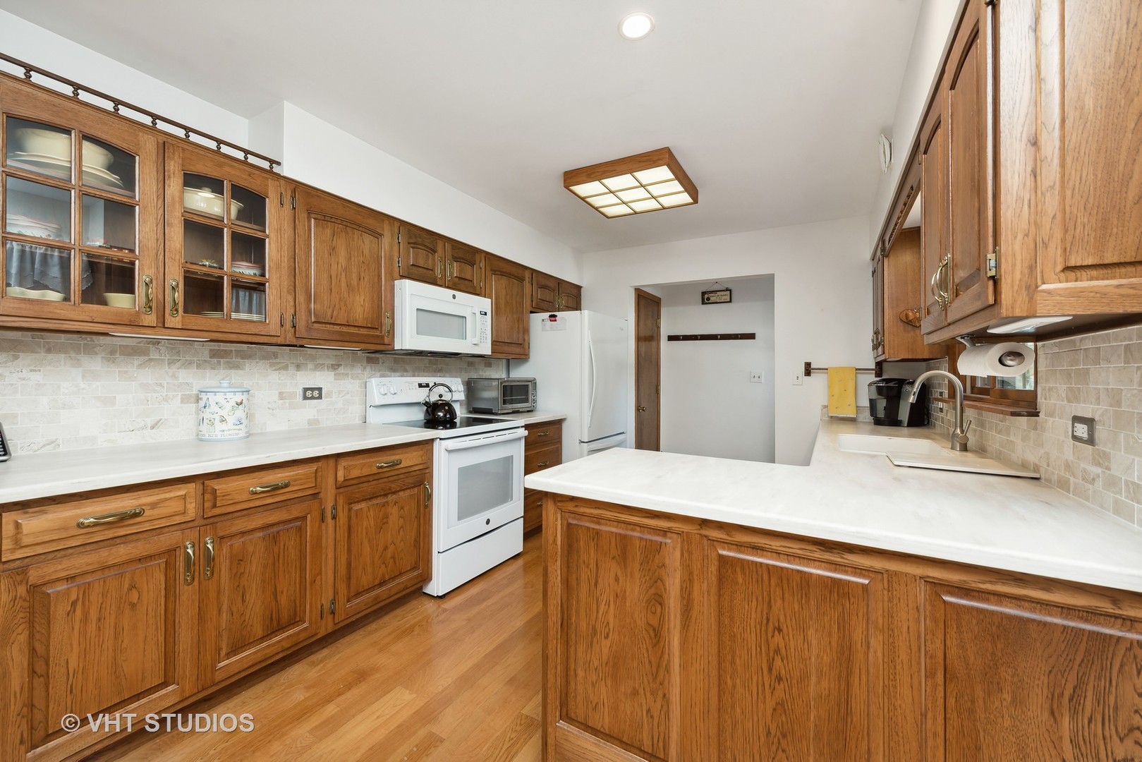 28046 Brandenburg Road Ingleside, IL 60041 - Photo 5 of 17 a kitchen with stainless steel appliances granite countertop a sink dishwasher stove and refrigerator with wooden floor