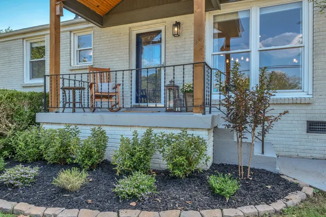 a front view of a house with garden
