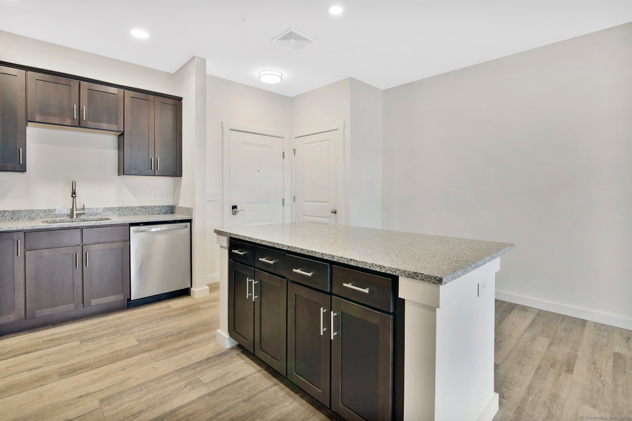 280 Salmon Brook Street, Unit 6114A Granby, CT 06035 - Photo 13 of 34 a kitchen with a sink and cabinets