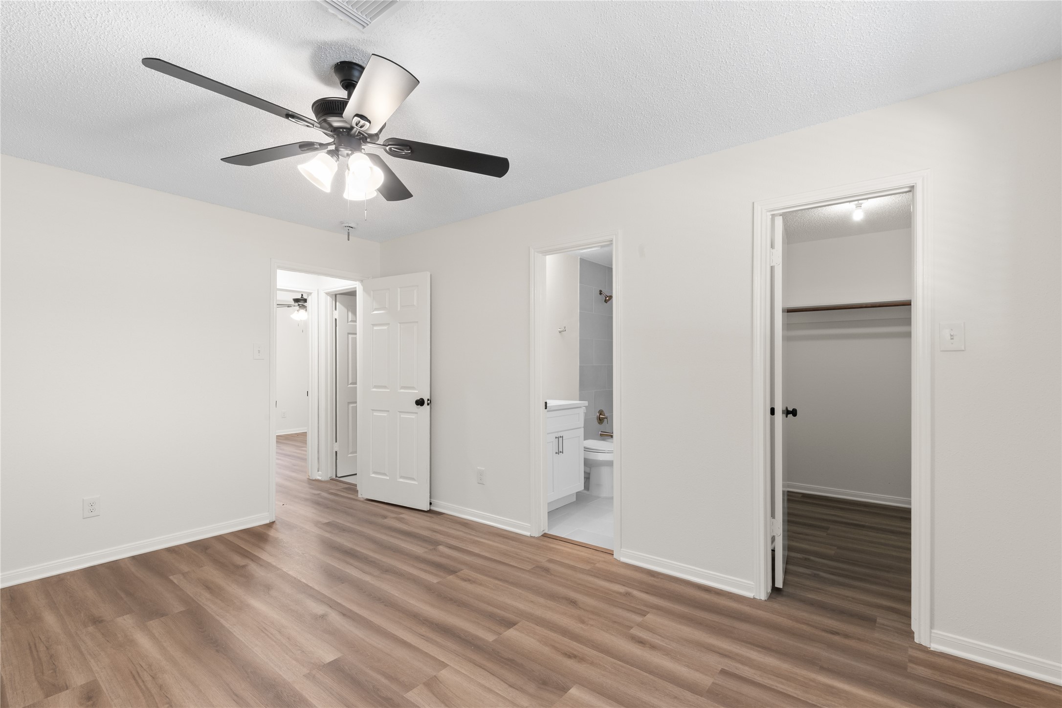 907 Avenue B Sweeny, TX 77480 - Photo 16 of 23 a view of a livingroom with a chandelier fan and wooden floor