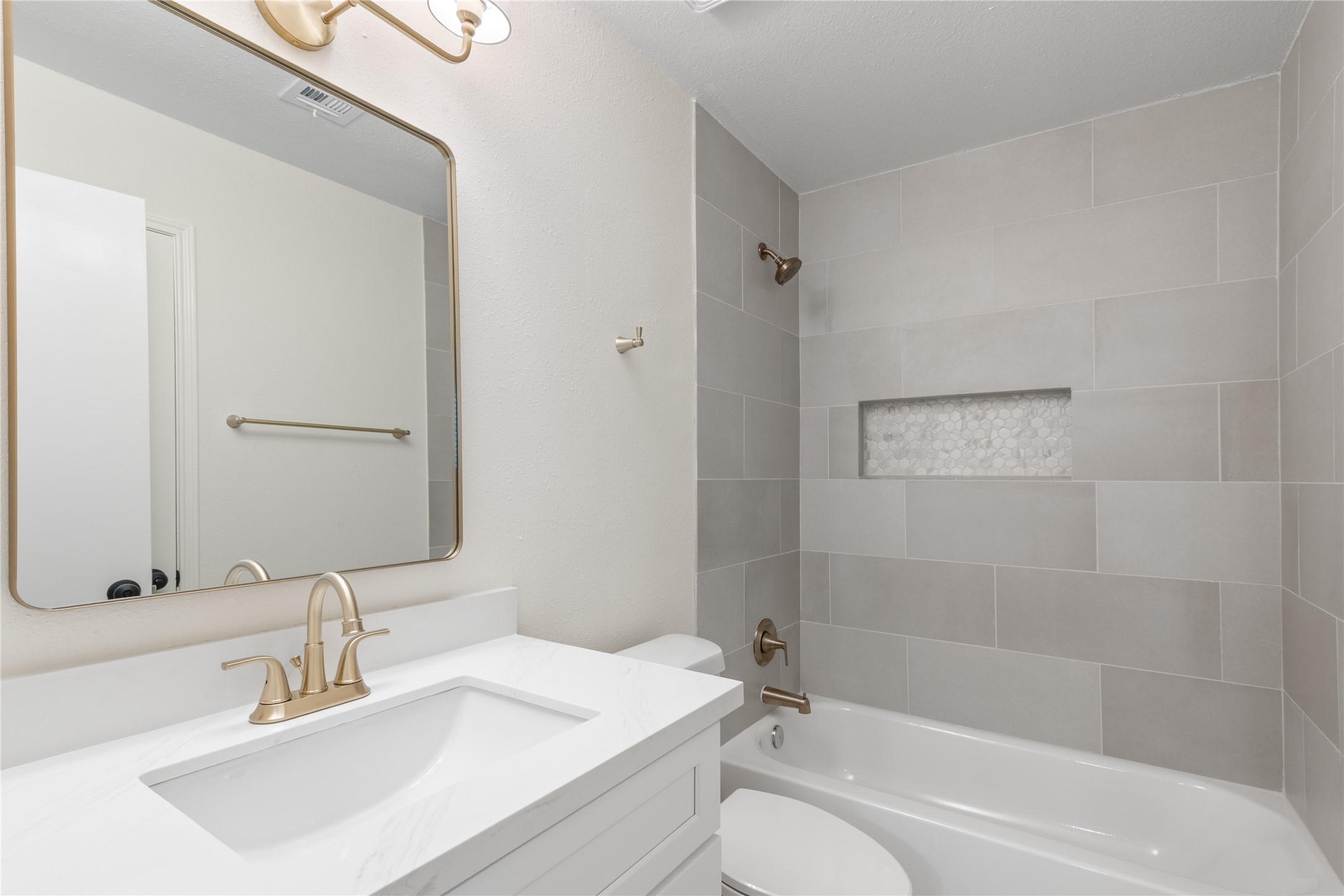 907 Avenue B Sweeny, TX 77480 - Photo 17 of 23 a bathroom with a sink toilet and shower