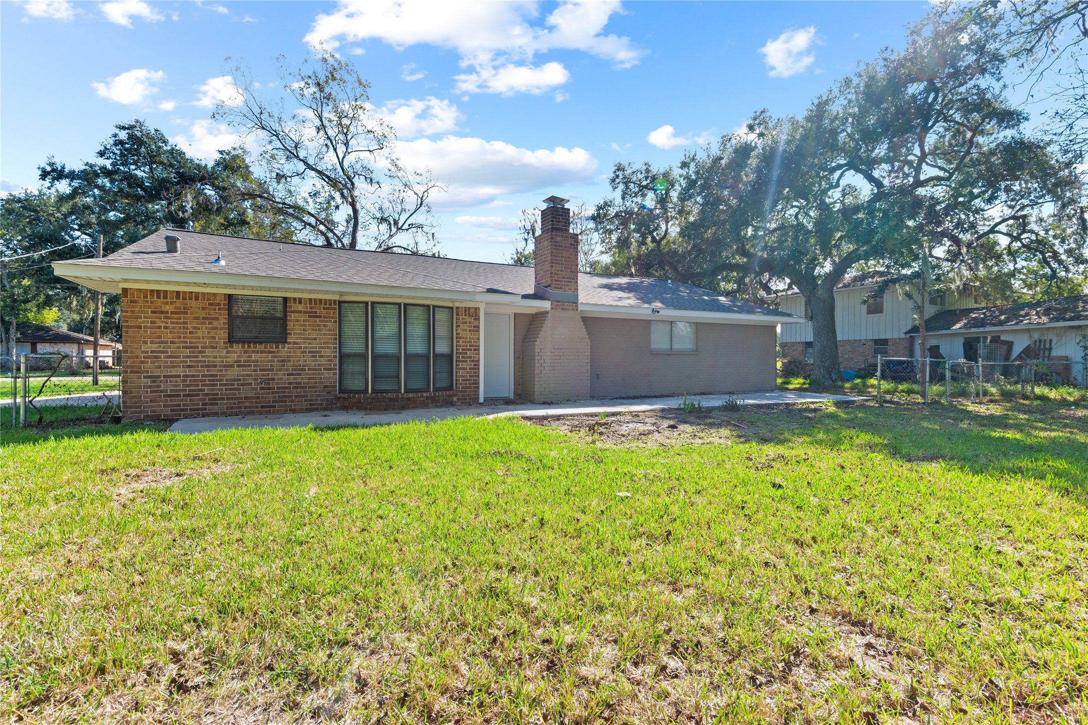 907 Avenue B Sweeny, TX 77480 - Photo 22 of 23 a view of a house with a backyard