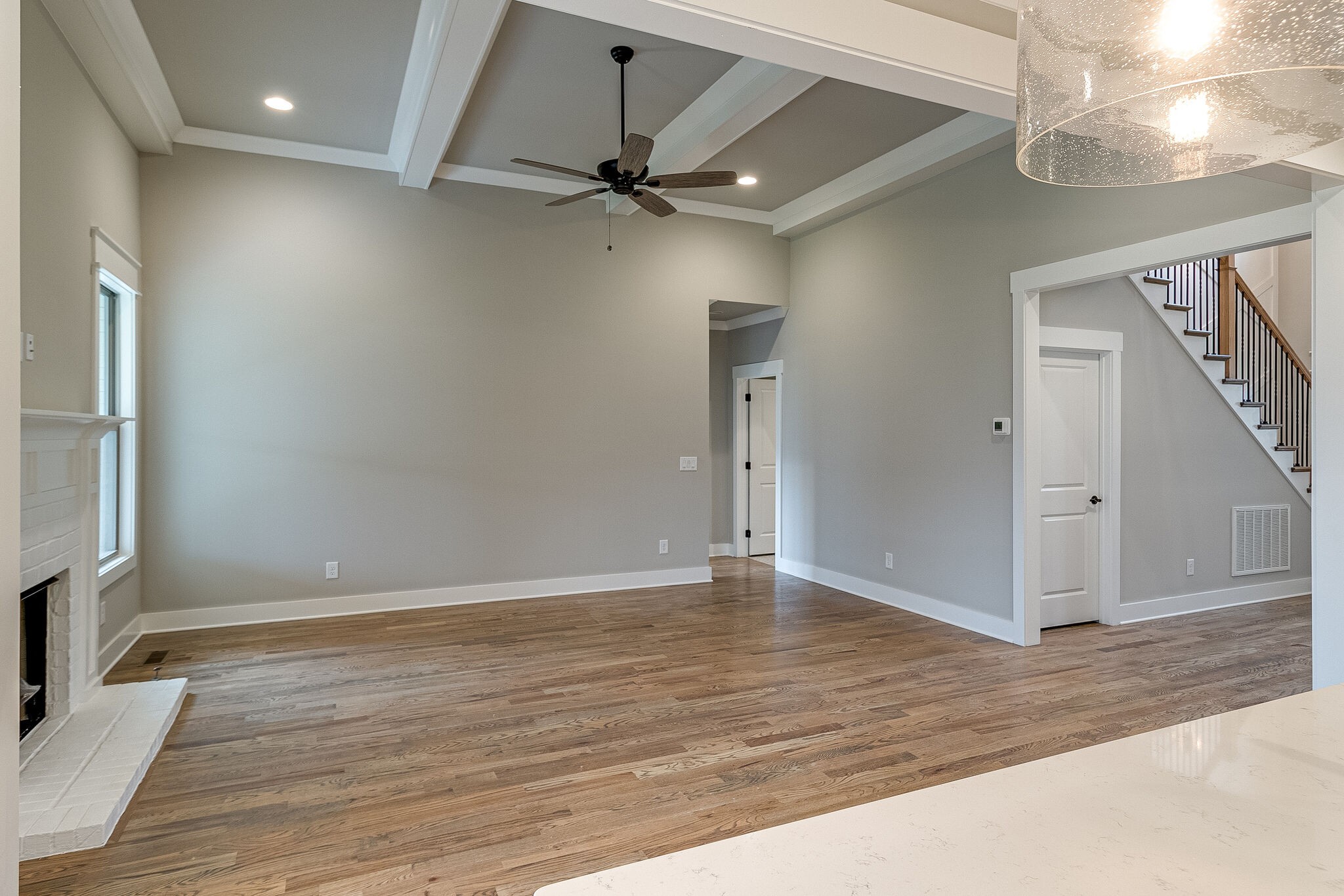 1028 Gadwall Lane Spring Hill, TN 37174 - Photo 11 of 40 an empty room with wooden floor fan and windows