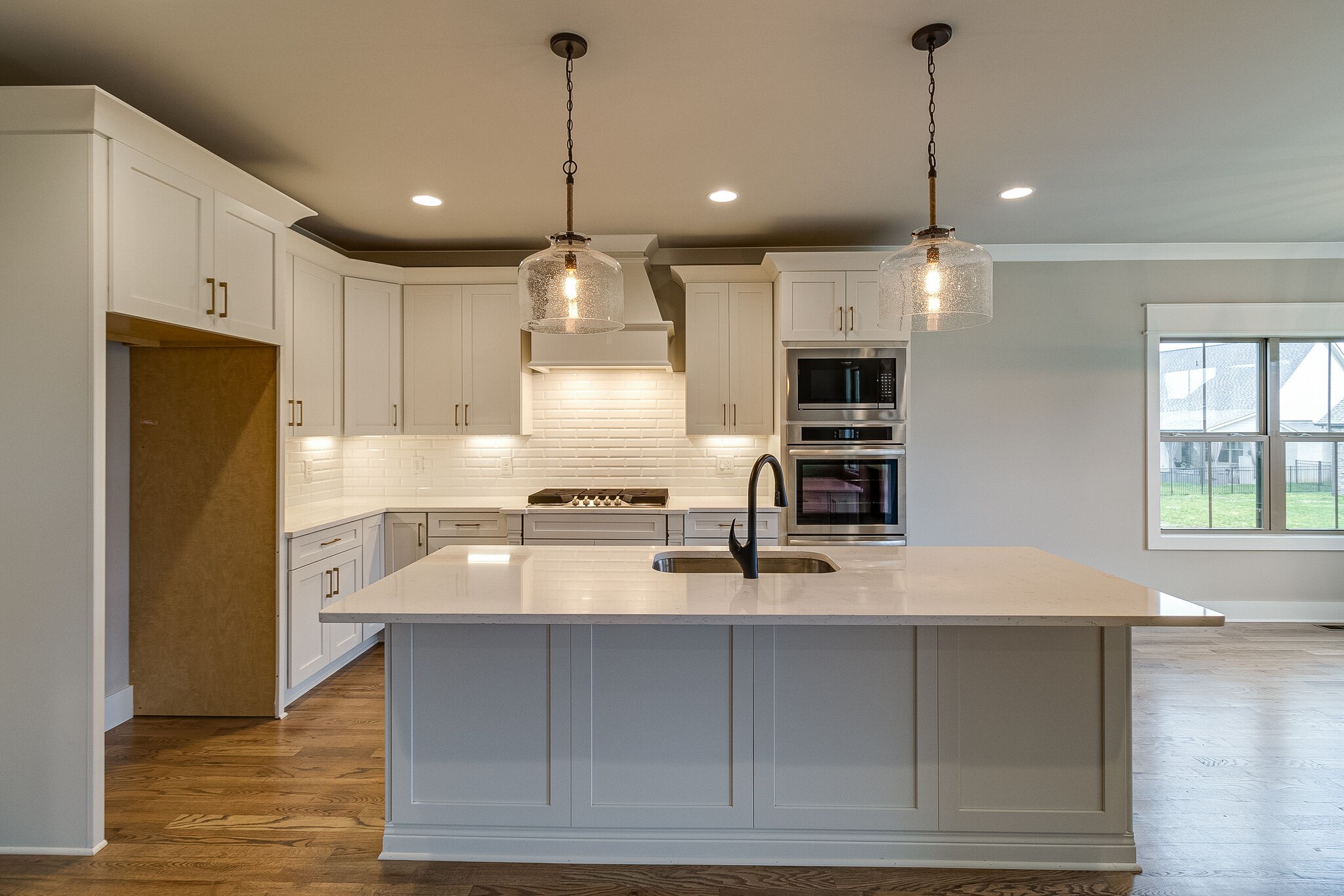 1028 Gadwall Lane Spring Hill, TN 37174 - Photo 13 of 40 a kitchen with kitchen island a counter space a sink appliances and cabinets