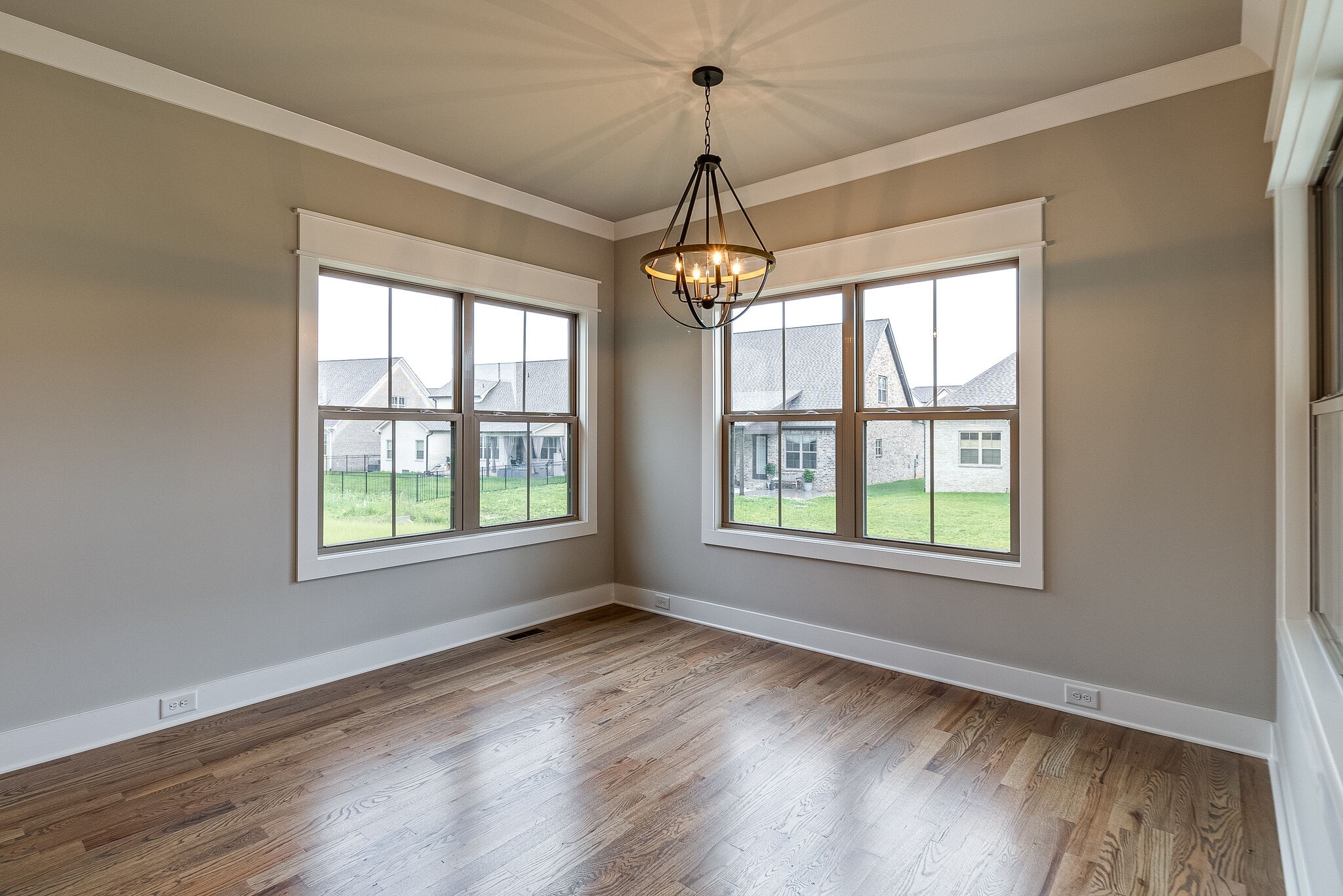 1028 Gadwall Lane Spring Hill, TN 37174 - Photo 18 of 40 a view of an empty room with wooden floor and a window