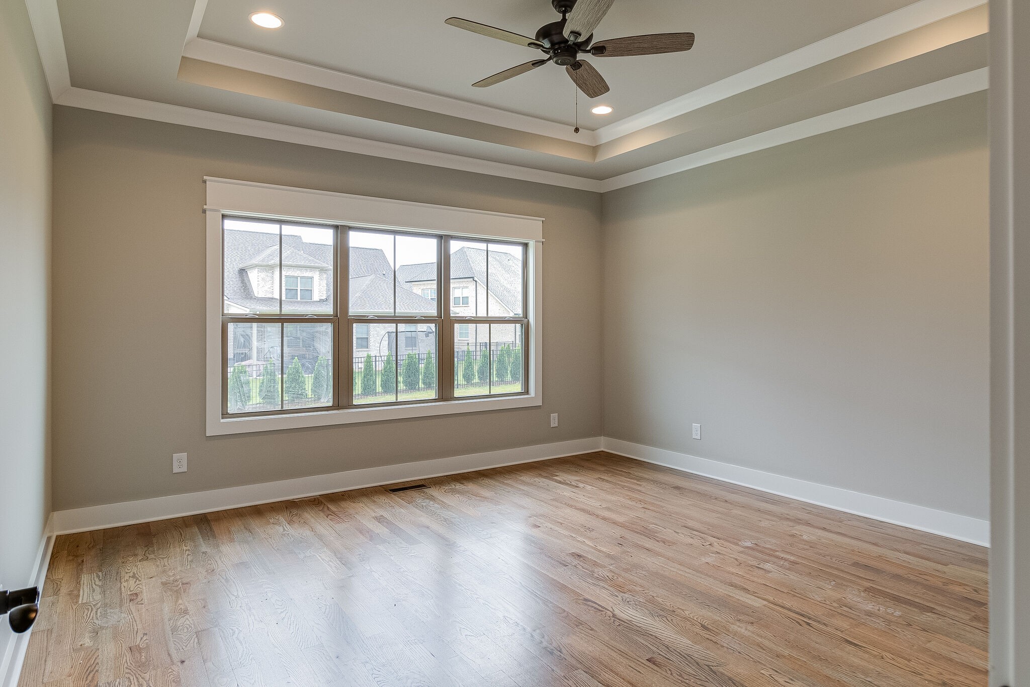 1028 Gadwall Lane Spring Hill, TN 37174 - Photo 20 of 40 a view of an empty room with wooden floor and a window