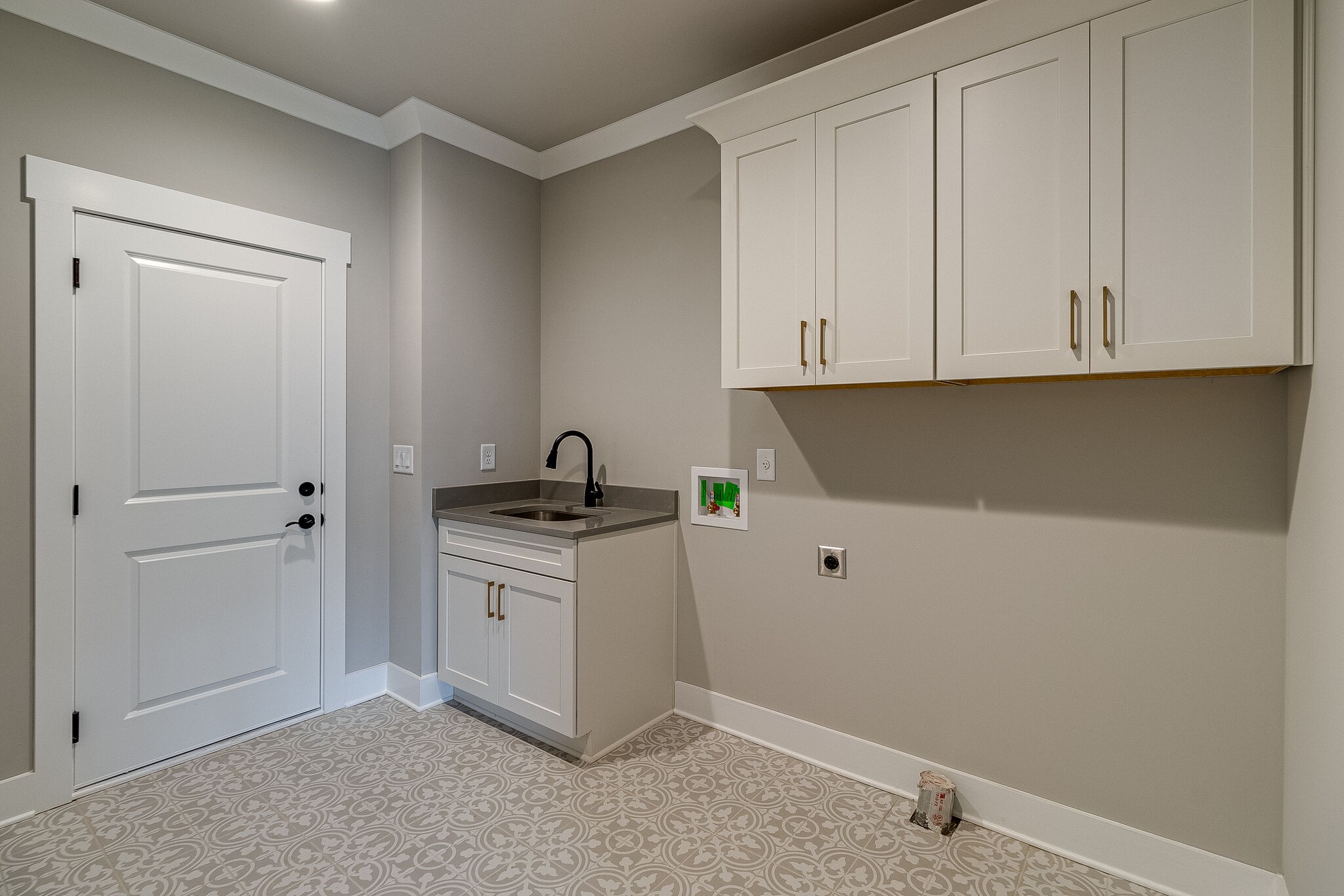 1028 Gadwall Lane Spring Hill, TN 37174 - Photo 26 of 40 a kitchen with white cabinets and white appliances