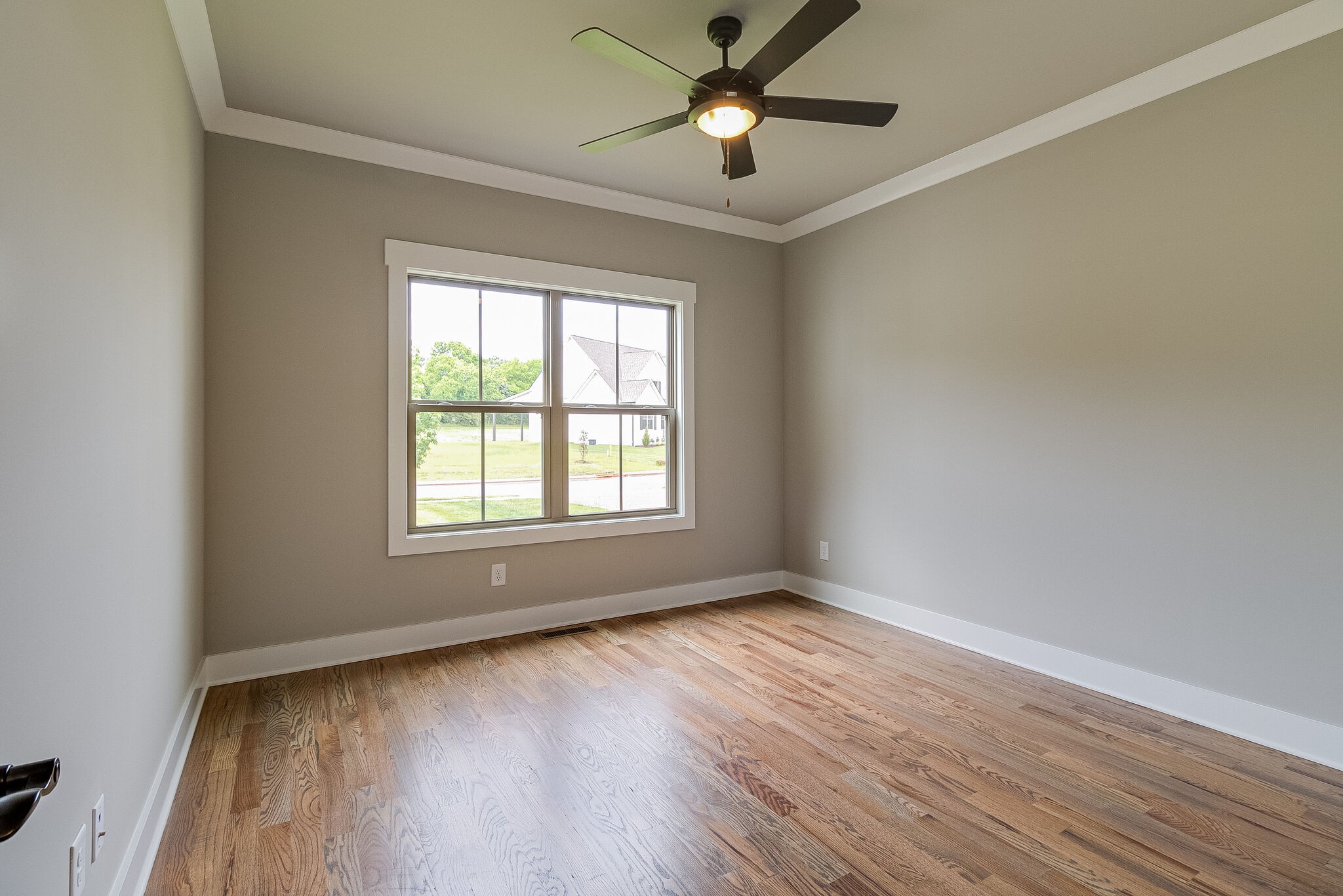 1028 Gadwall Lane Spring Hill, TN 37174 - Photo 27 of 40 a view of an empty room with wooden floor and a window