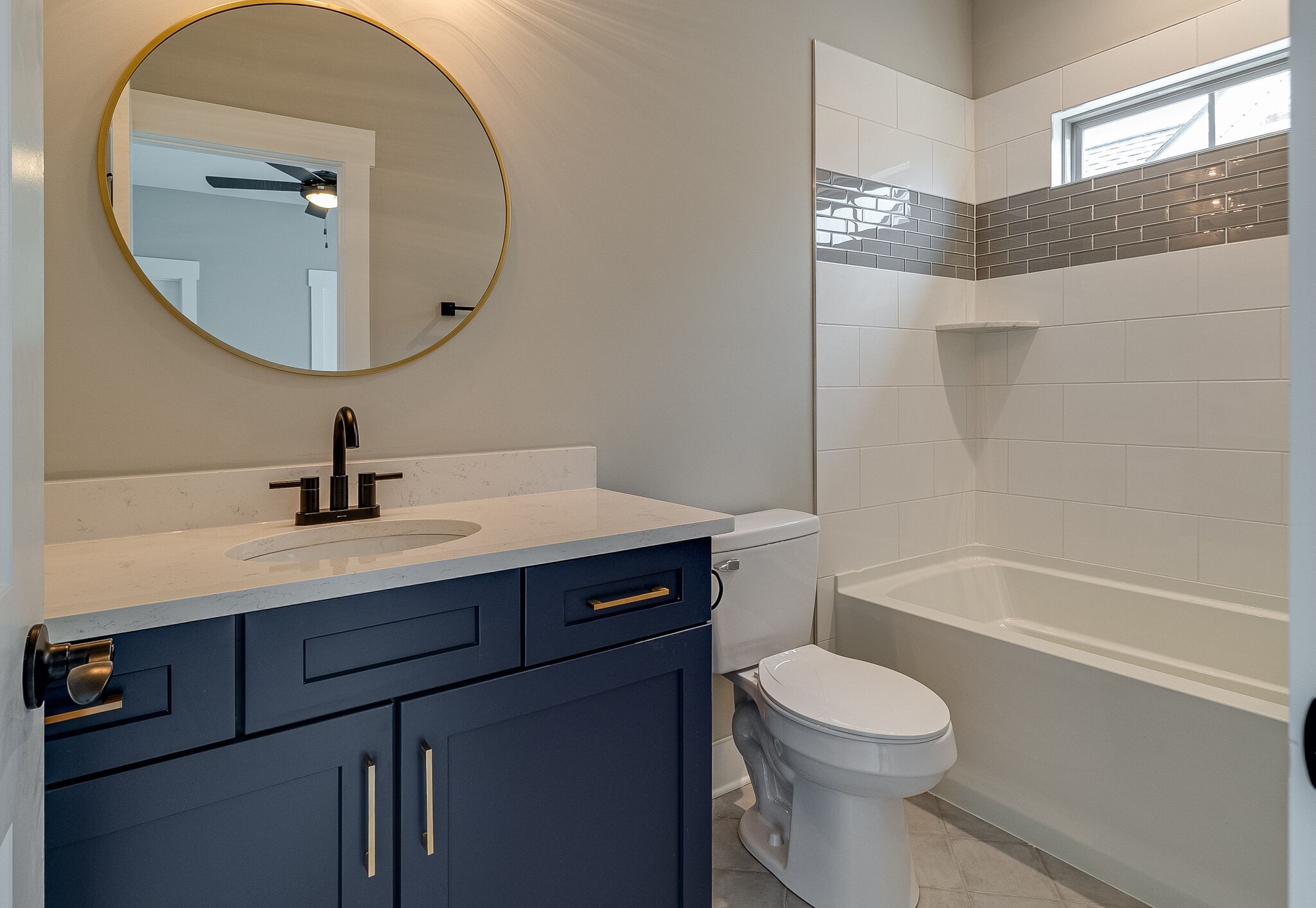 1028 Gadwall Lane Spring Hill, TN 37174 - Photo 31 of 40 a bathroom with a sink a toilet and a mirror