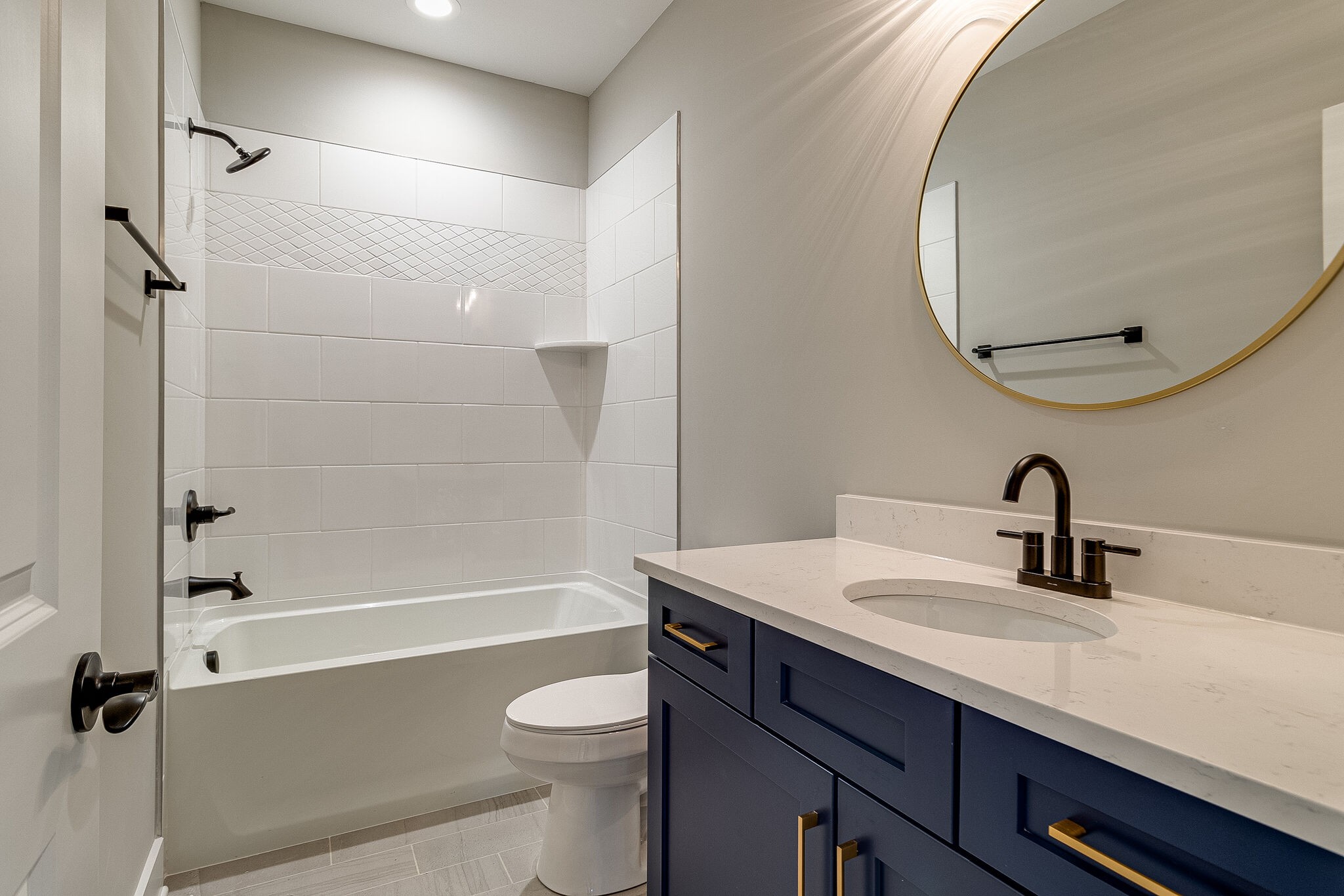 1028 Gadwall Lane Spring Hill, TN 37174 - Photo 34 of 40 a bathroom with a sink a toilet and shower