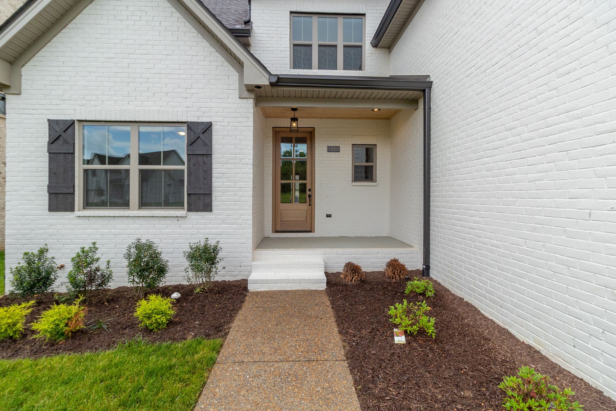 1028 Gadwall Lane Spring Hill, TN 37174 - Photo 6 of 40 a front view of a house with outdoor seating