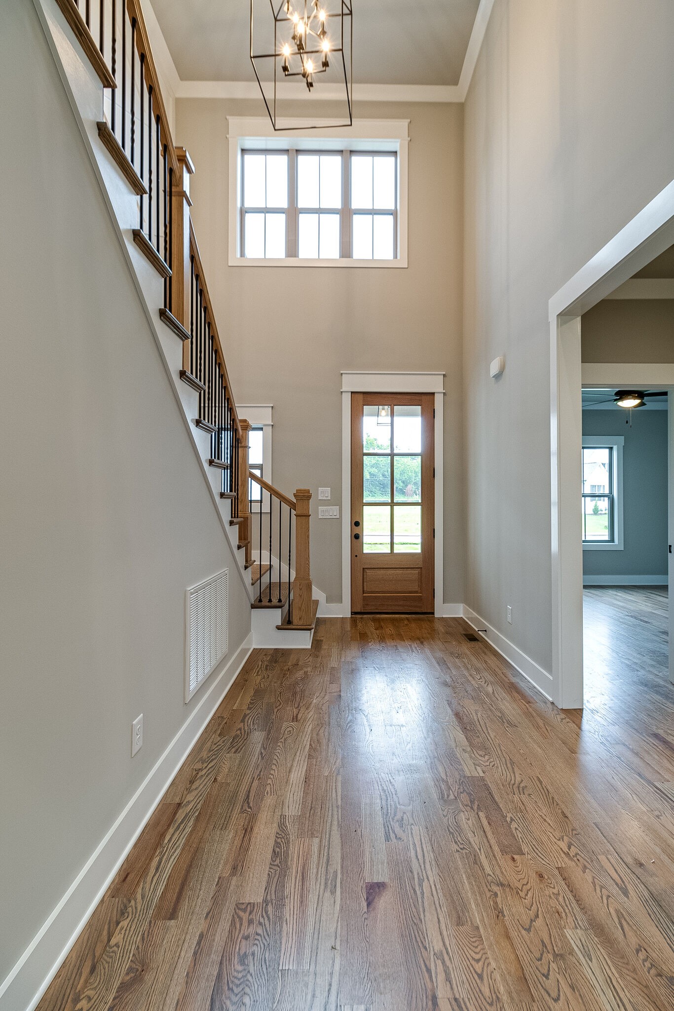 1028 Gadwall Lane Spring Hill, TN 37174 - Photo 8 of 40 wooden floor in an empty room with a window and wooden floor