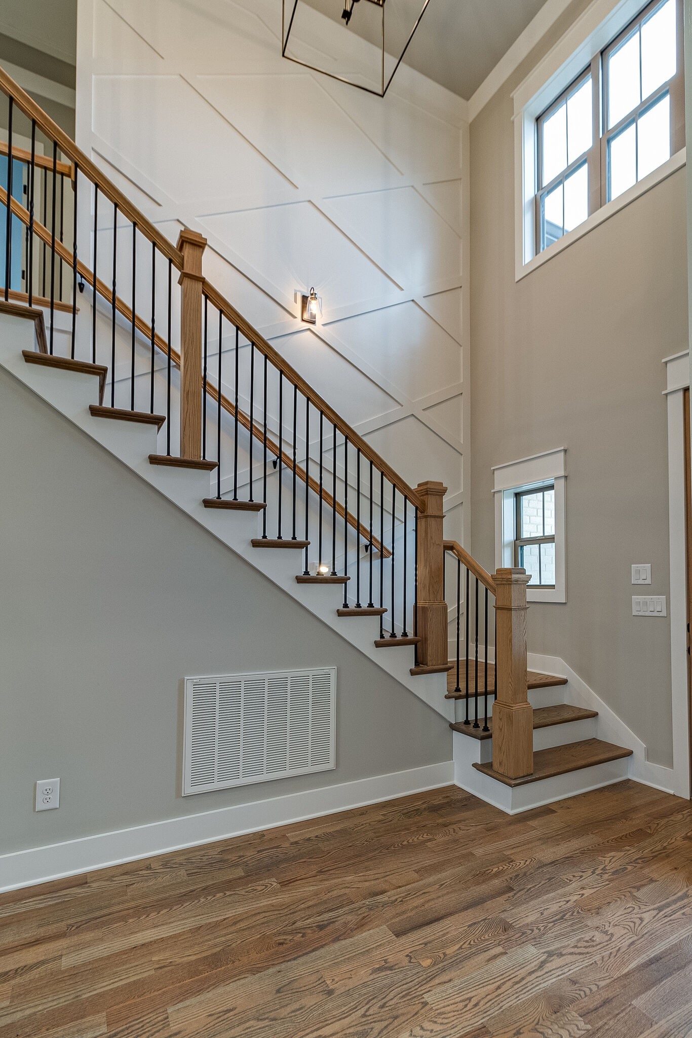 1028 Gadwall Lane Spring Hill, TN 37174 - Photo 9 of 40 a view of staircase with lots of frames and a floor to ceiling window