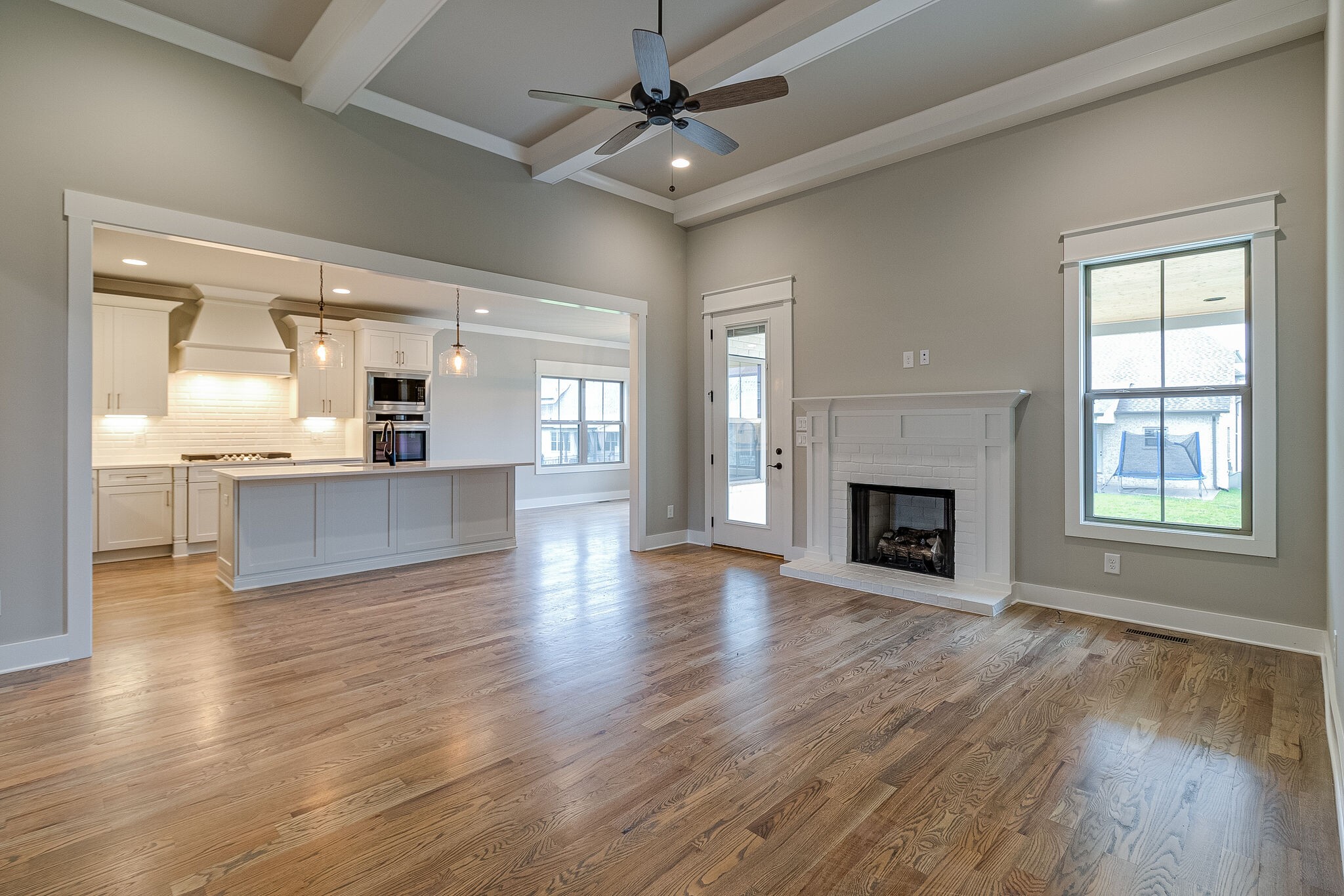 1028 Gadwall Lane Spring Hill, TN 37174 - Photo 10 of 40 wooden floor fireplace and windows in an empty room