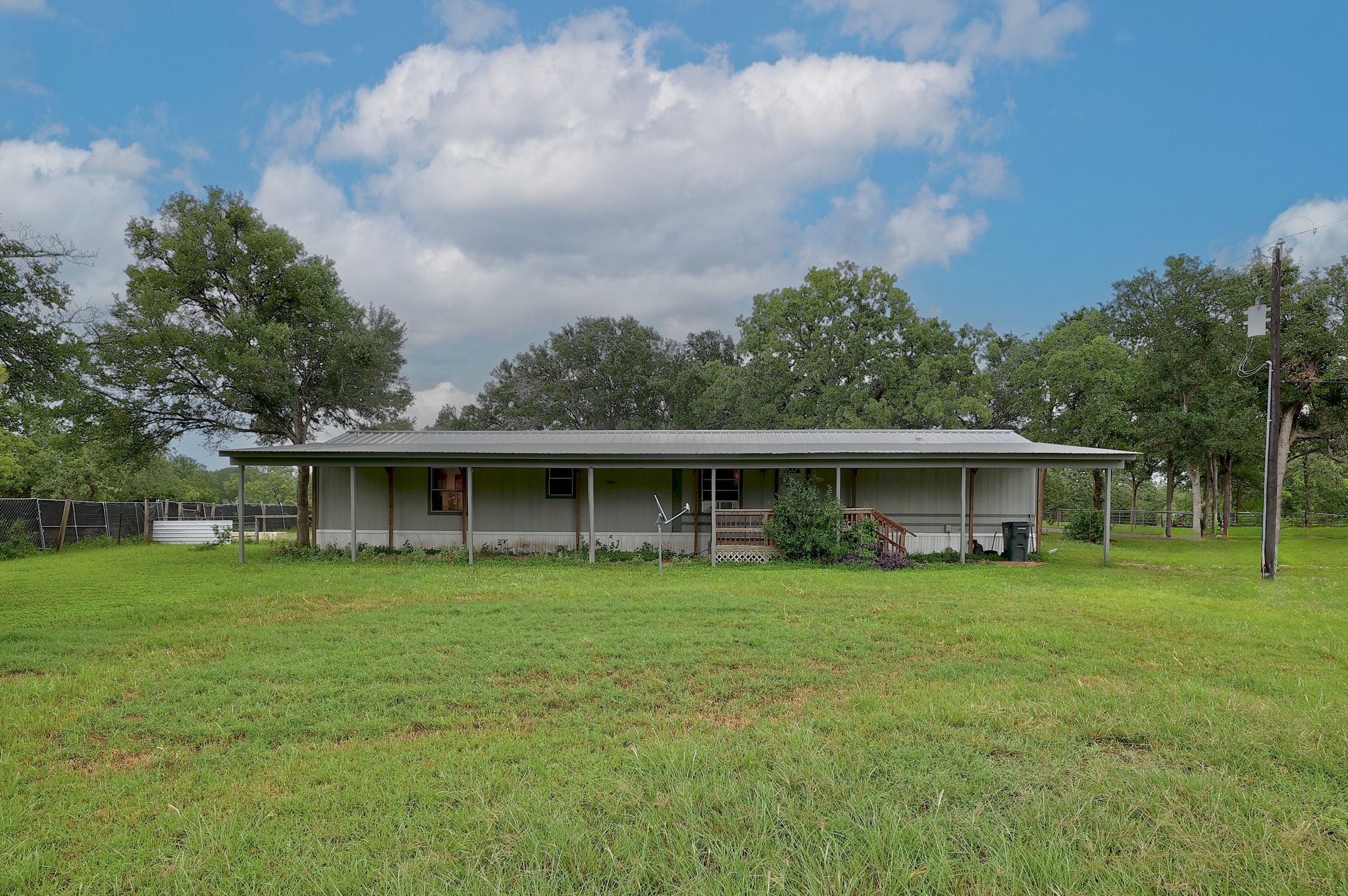 288 The Forest Road Dale, TX 78616 - Photo 2 of 31 a view of a house with yard and sitting area