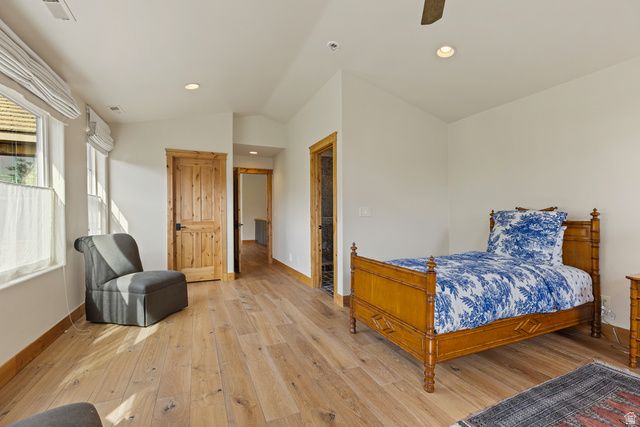 105 River Bend Circle, Unit 105 Springdale, UT 84767 - Photo 31 of 56 Spacious room featuring wood-finish flooring, white walls, and natural wood doors with dark hardware