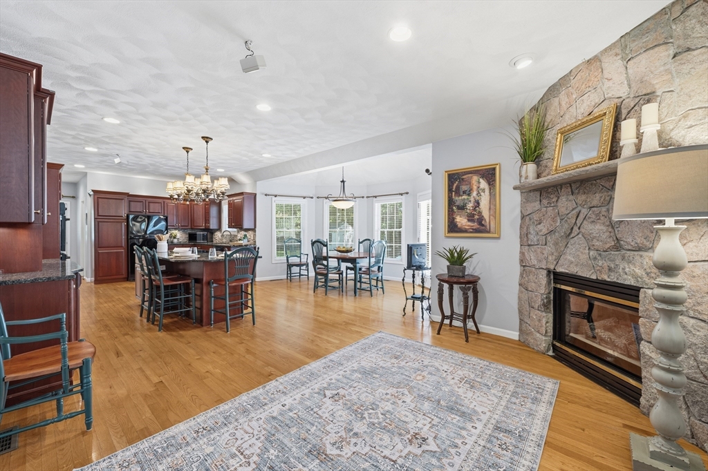 25 Haymeadow Road Boxford, MA 01921 - Photo 17 of 42 a living room with furniture and a fireplace