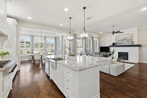 a view of a kitchen with kitchen island granite countertop a large center island attached withe living room