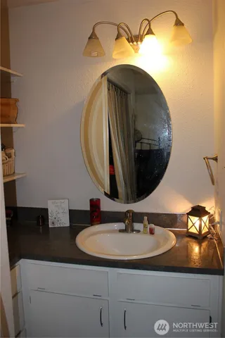 a bathroom with a sink and a mirror